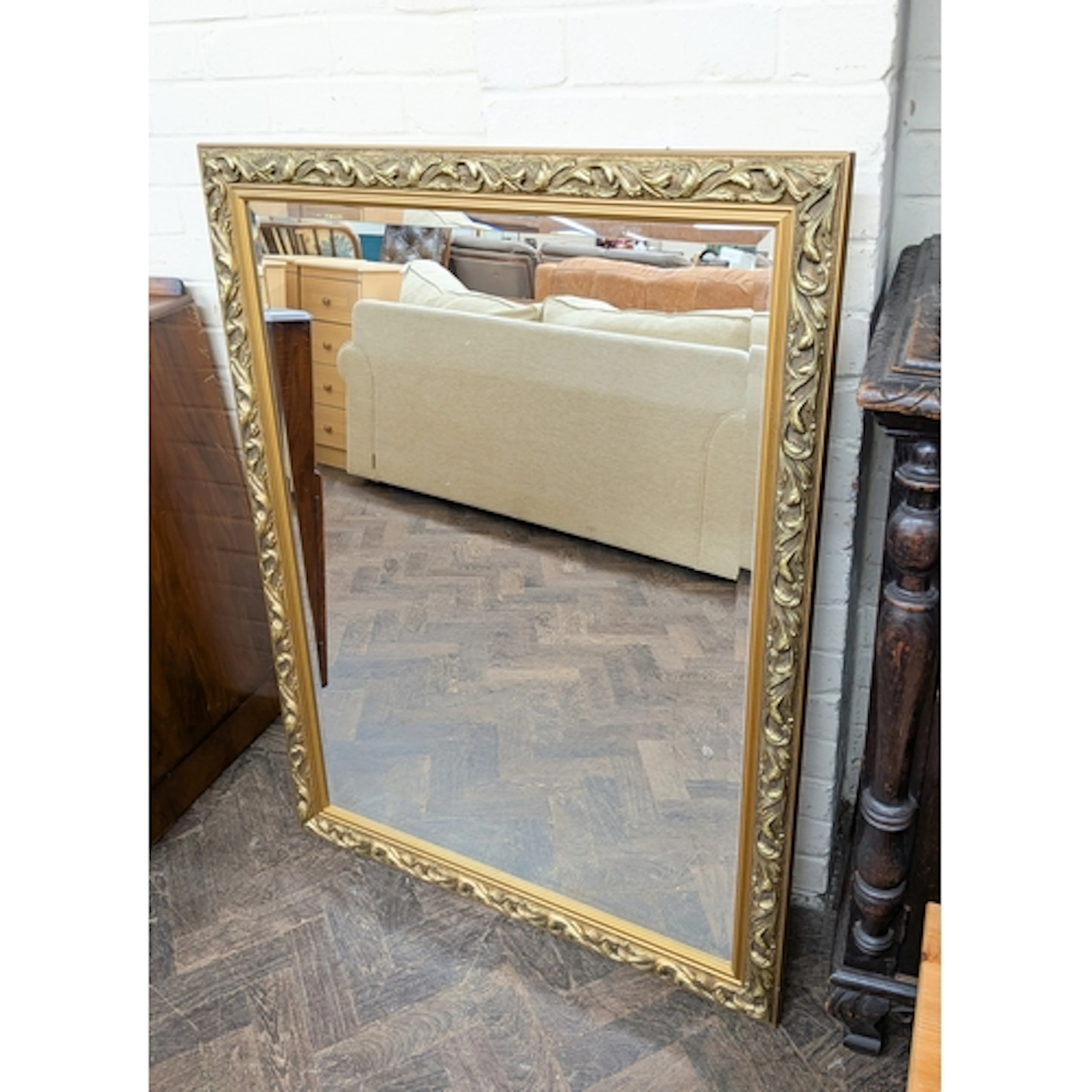 A large modern gilt framed rectangular over mantle mirror, a...