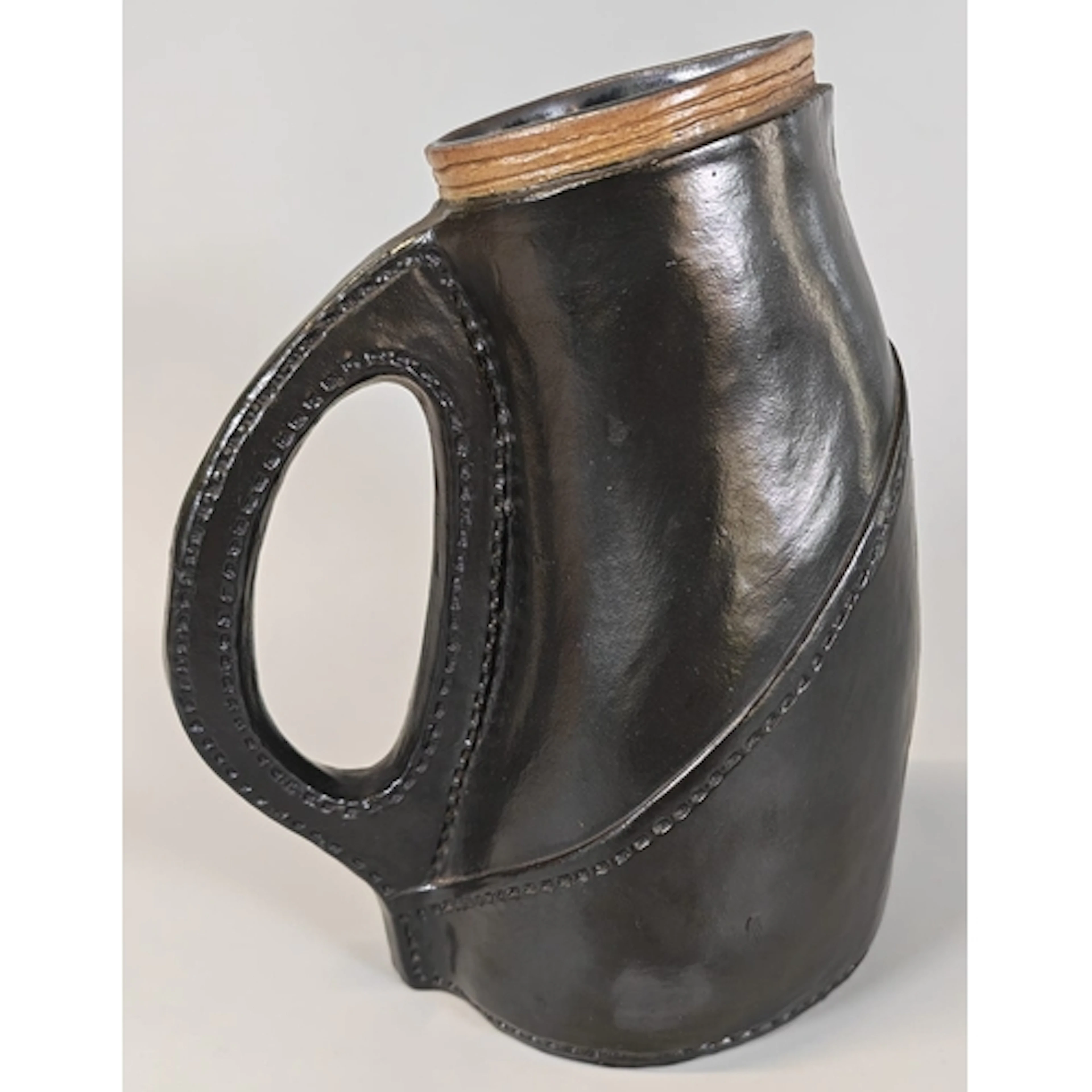 Doulton Lambeth 'Blackjack' jug, made of ceramic and modelle...