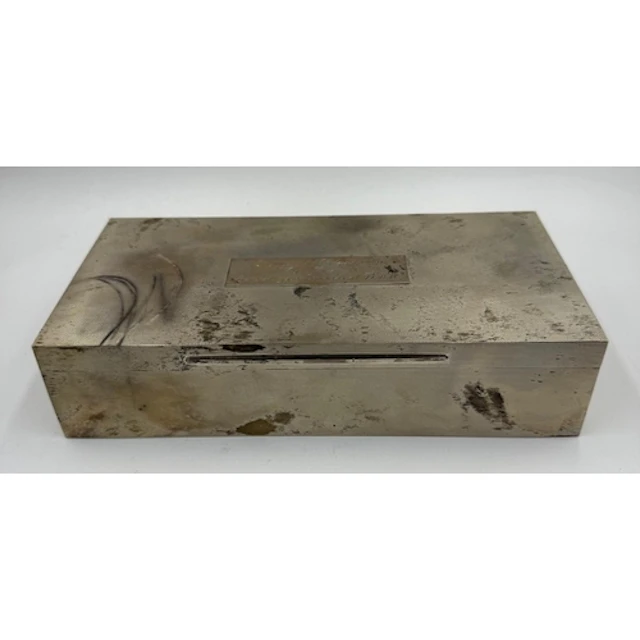 A silver Asprey cigarette box, bearing an inscribed plaque t...