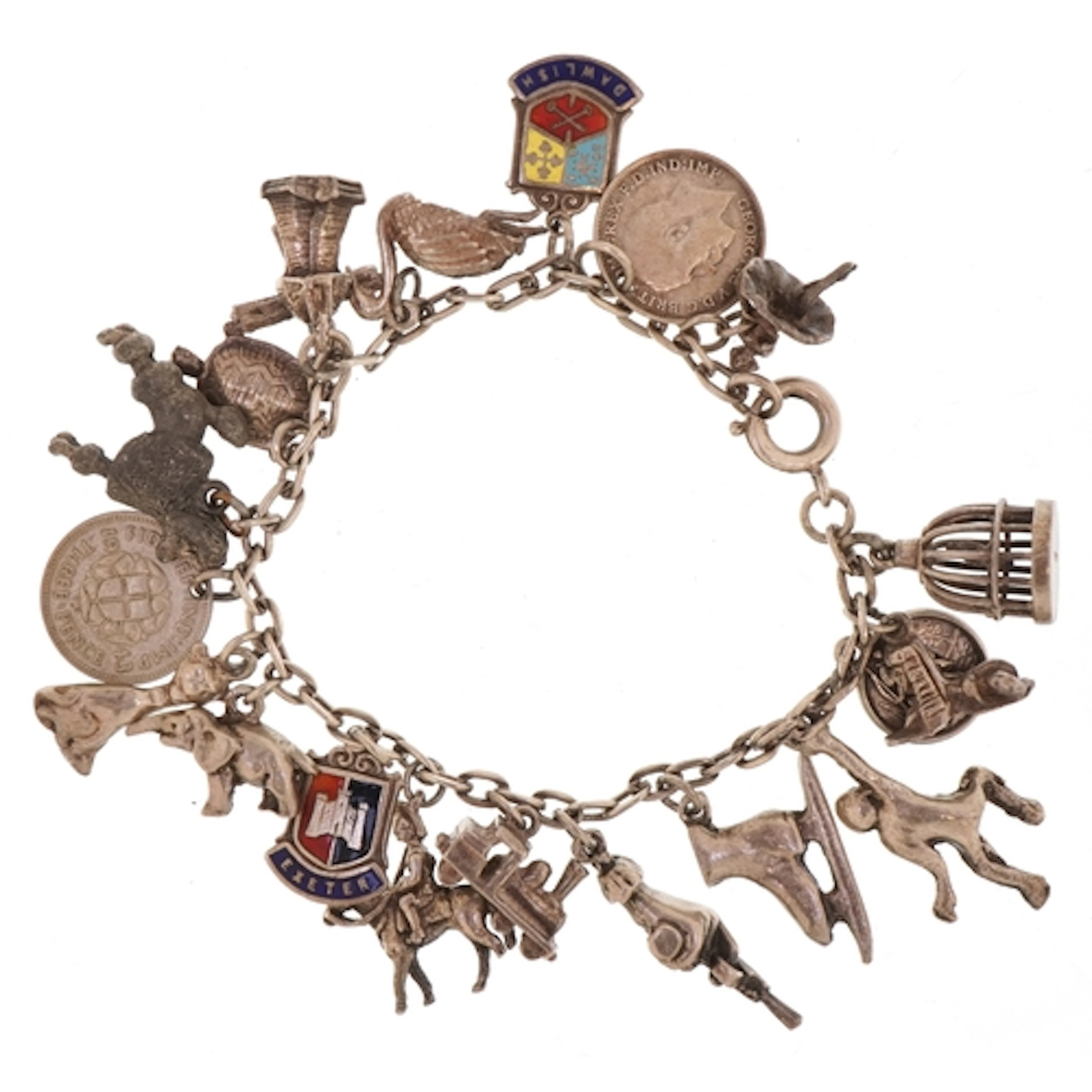A silver charm bracelet with a selection of mostly silver ch...