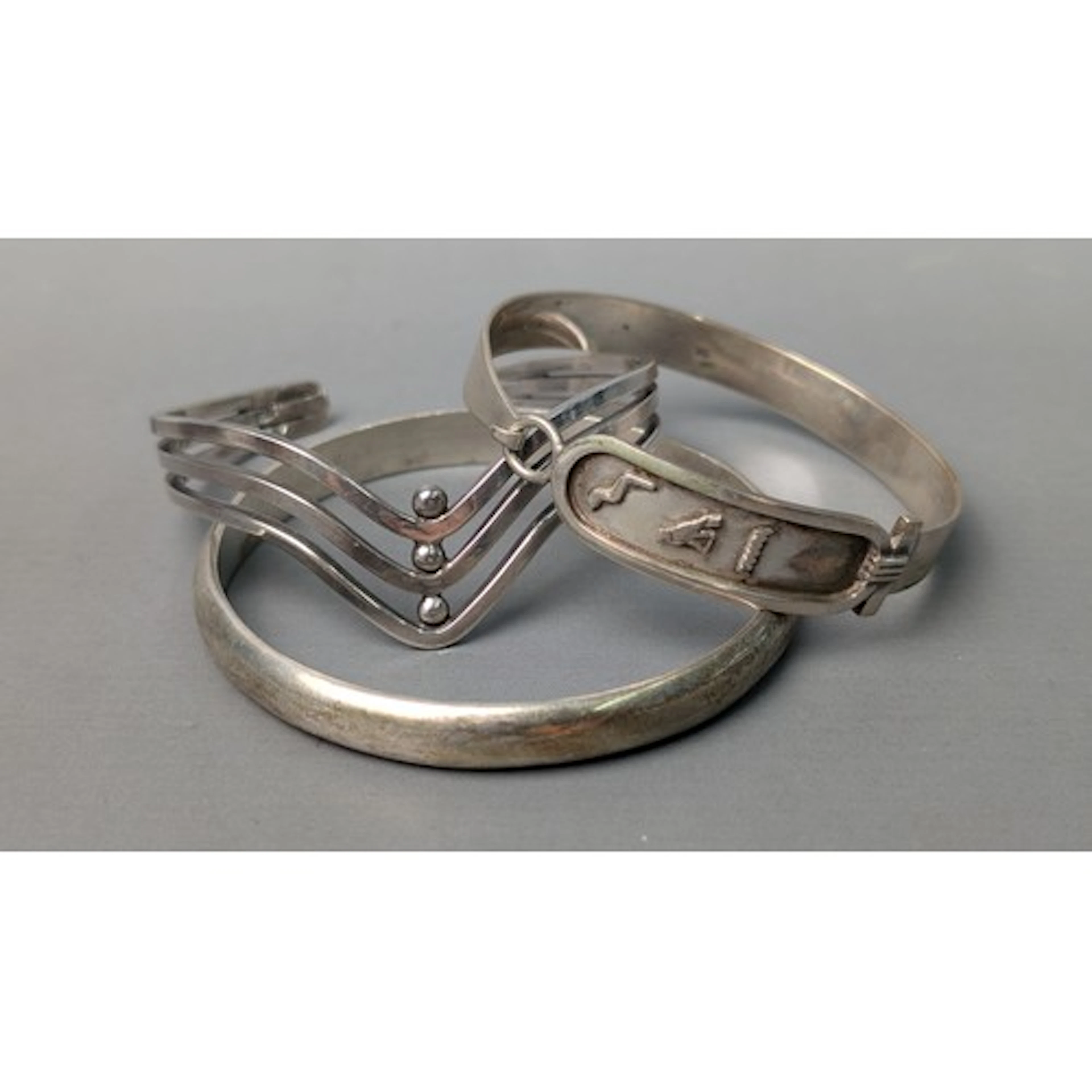 Egyptian 900-grade silver cuff and two 800-grade bangles, Eg...