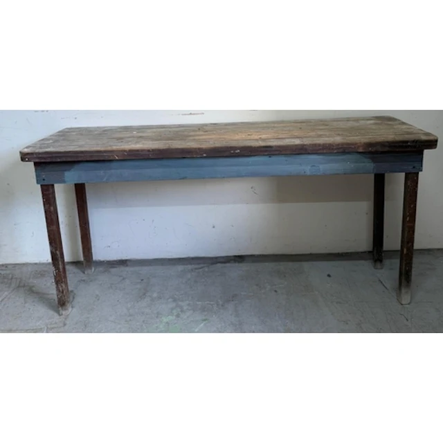 A light oak writing desk with one long central drawer and fo...