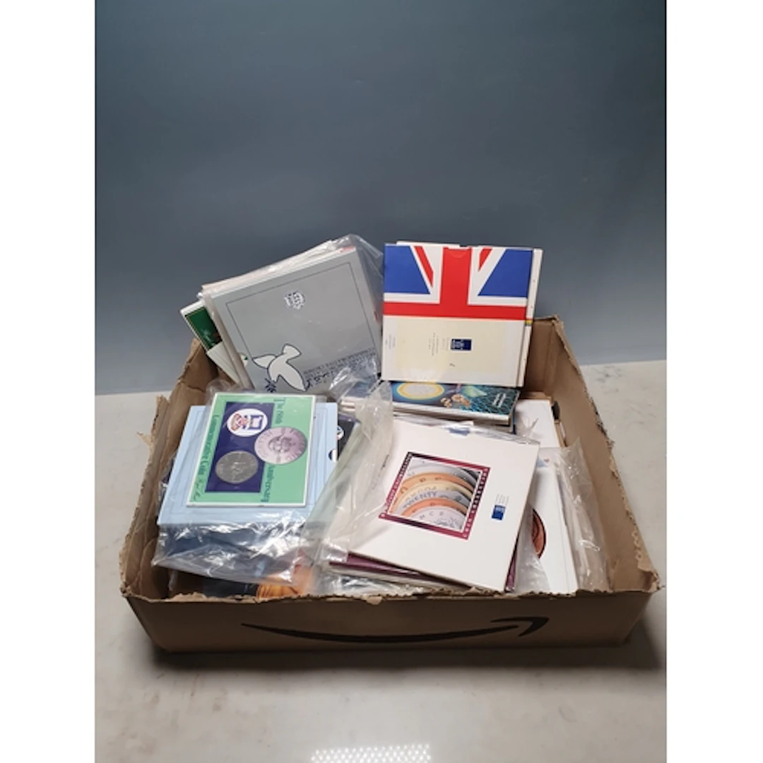 A collection of Royal Mint uncirculated sets, single coin pa...