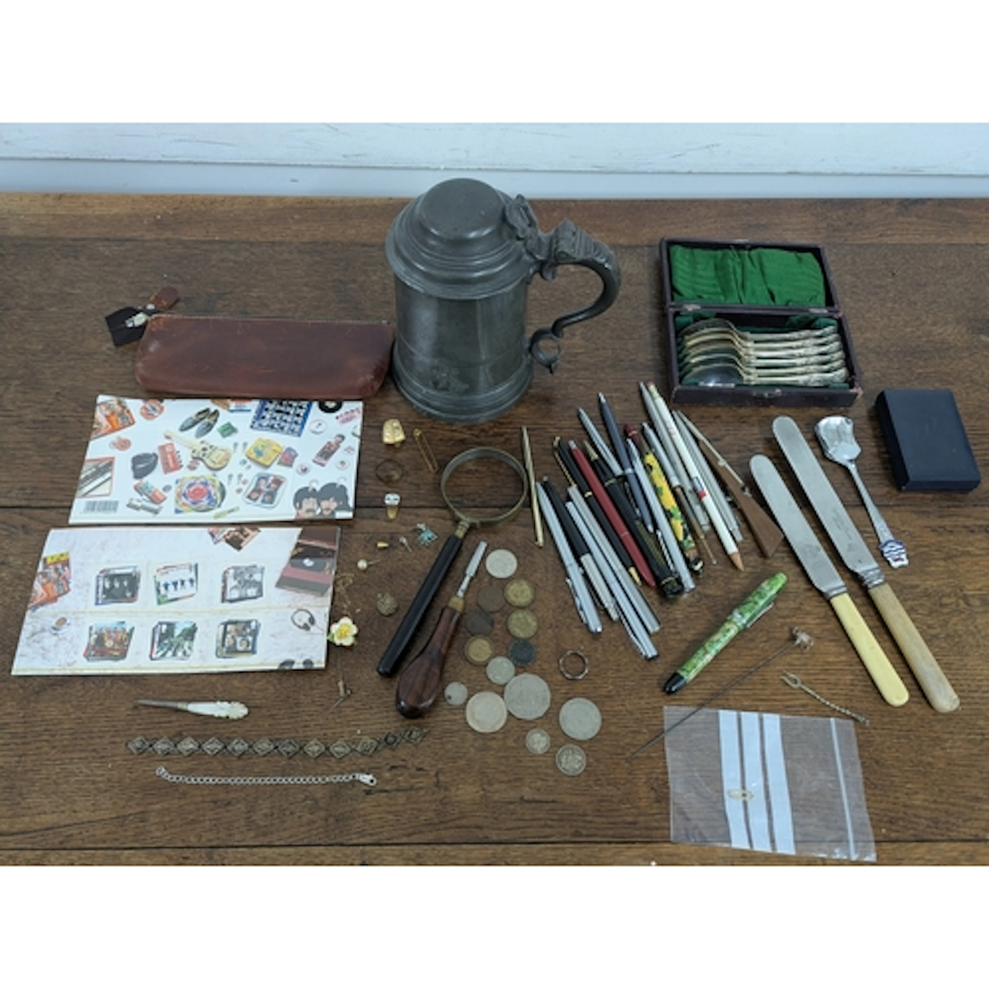 A mixed lot to include a white metal bracelet, two half silv...