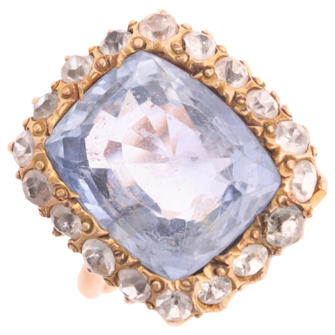 A sapphire and paste cluster ring, set with 8.60ct rectangul...