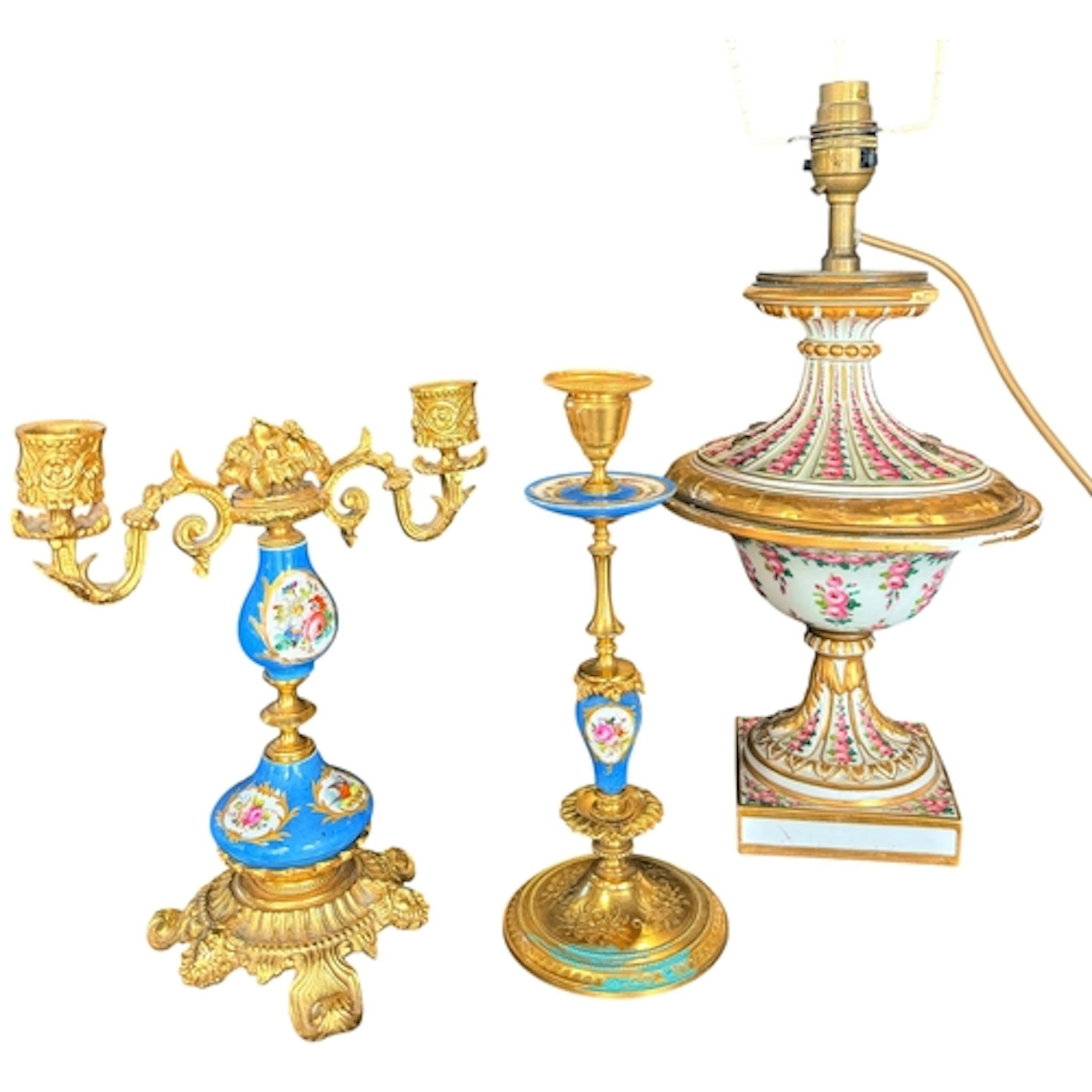 A 19th century French porcelain table lamp, together with tw...