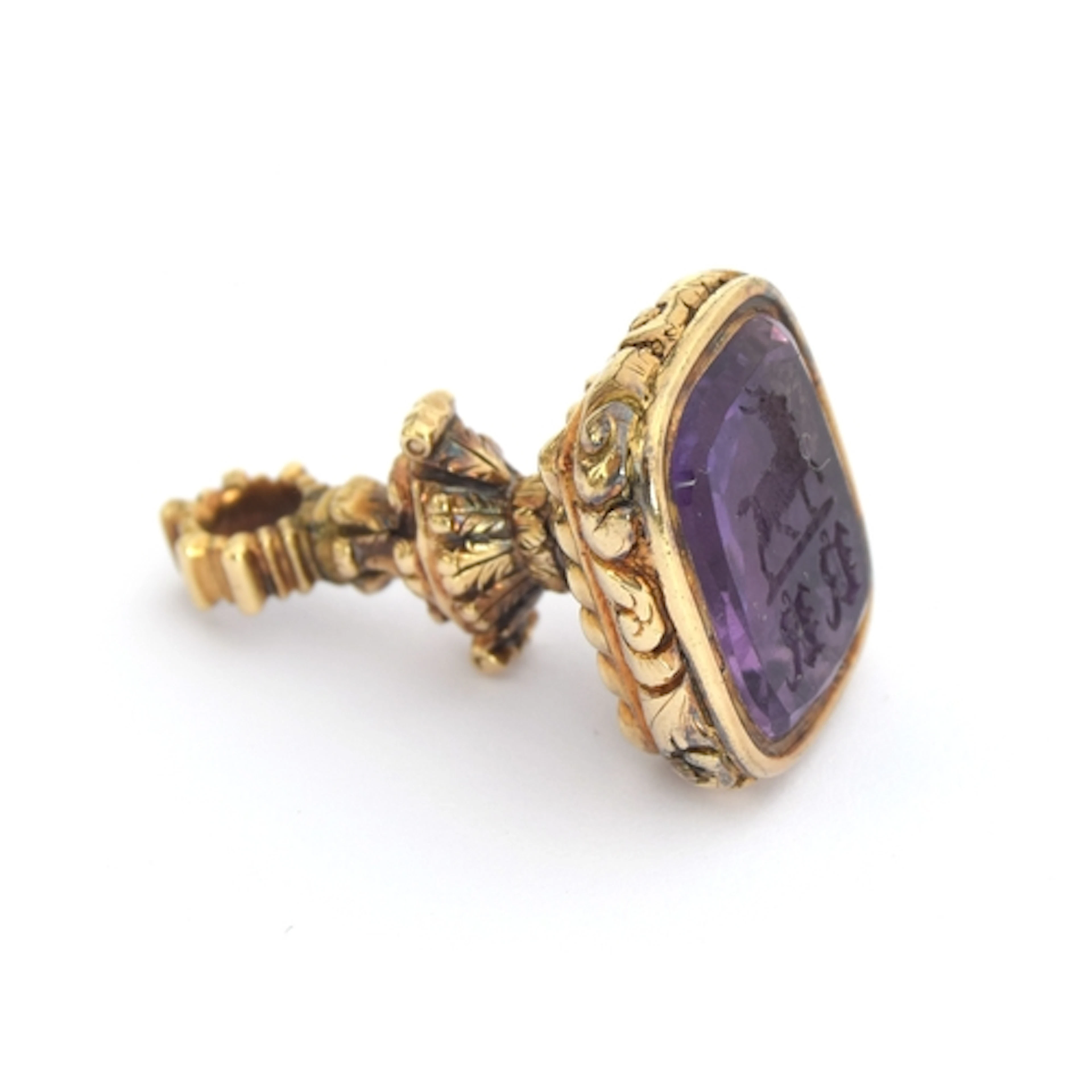 A 19th century gold fob seal, the foiled amethyst intaglio c...