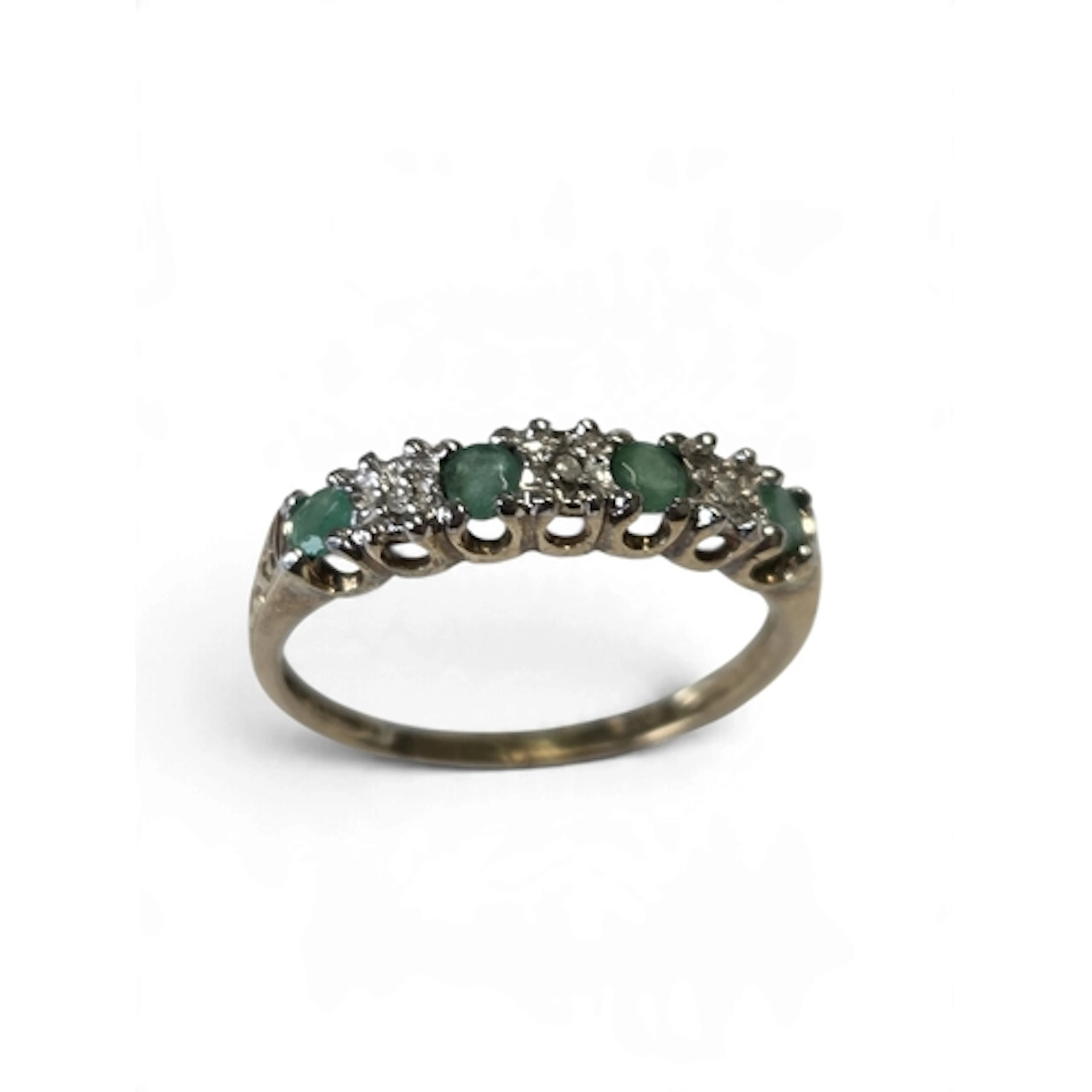 A good 9-carat gold seven-stone diamond and emerald ring, th...