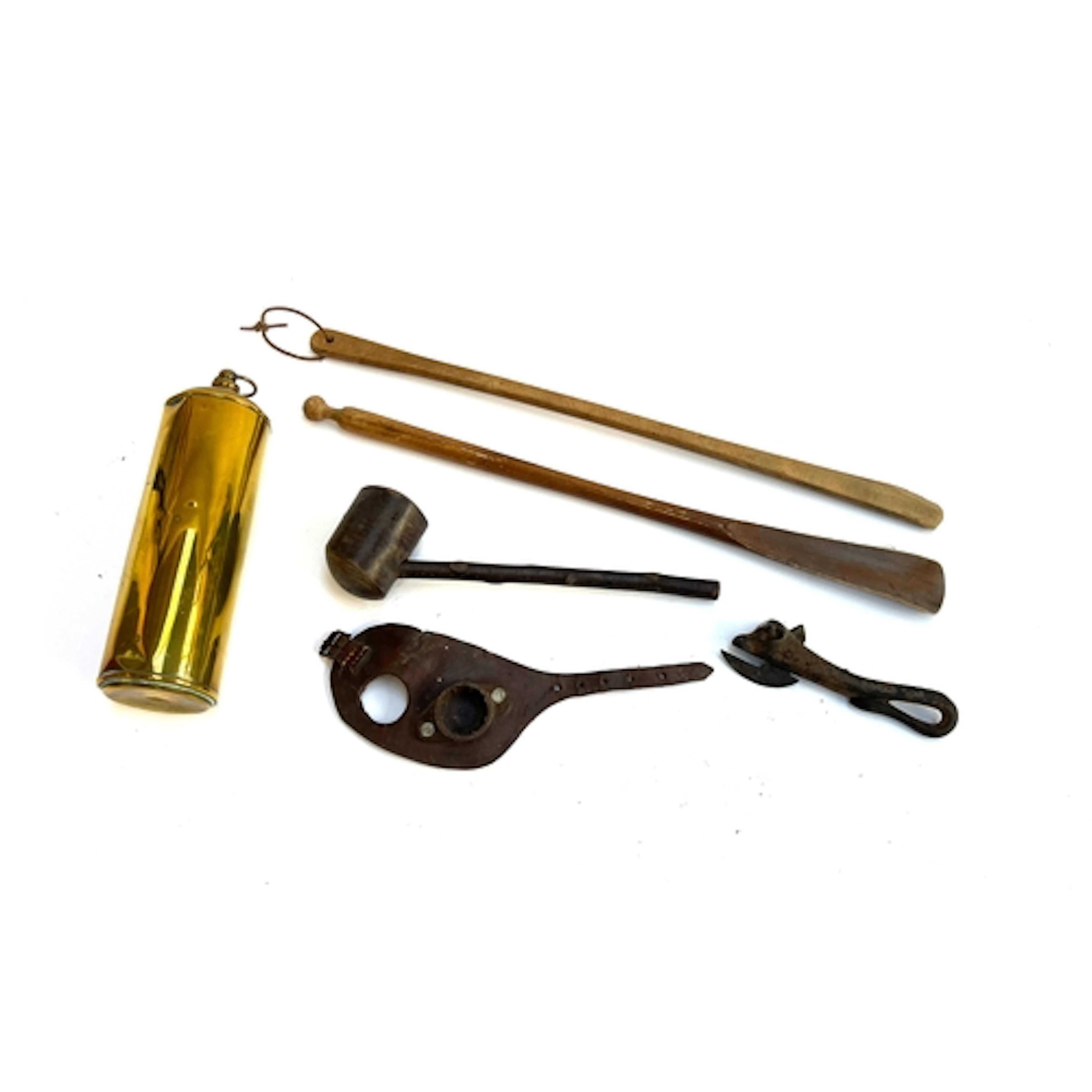 A mixed lot to include two shoe horns, pipe, cast iron tin o...