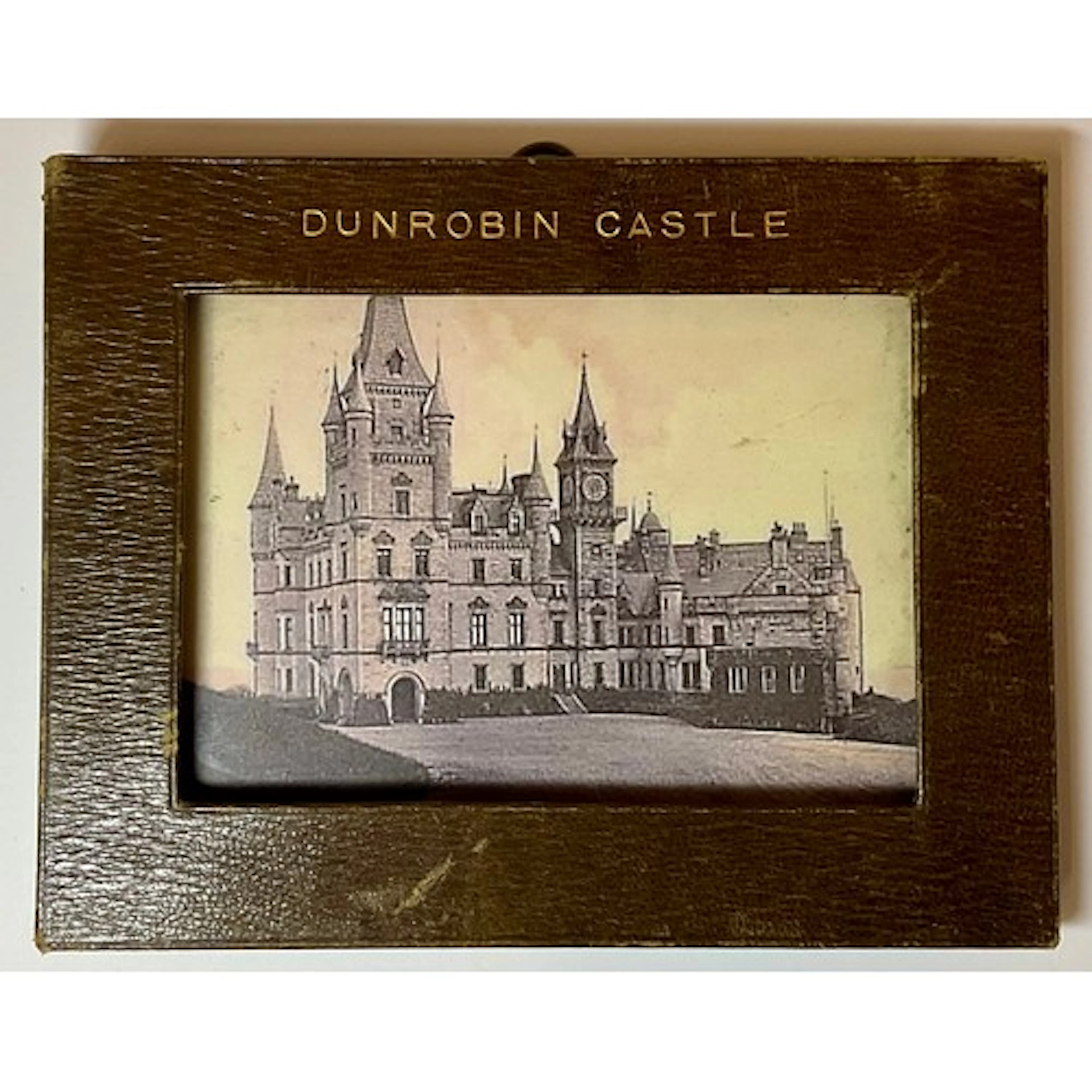 An Edwardian rectangular brown leather photograph frame, emb...