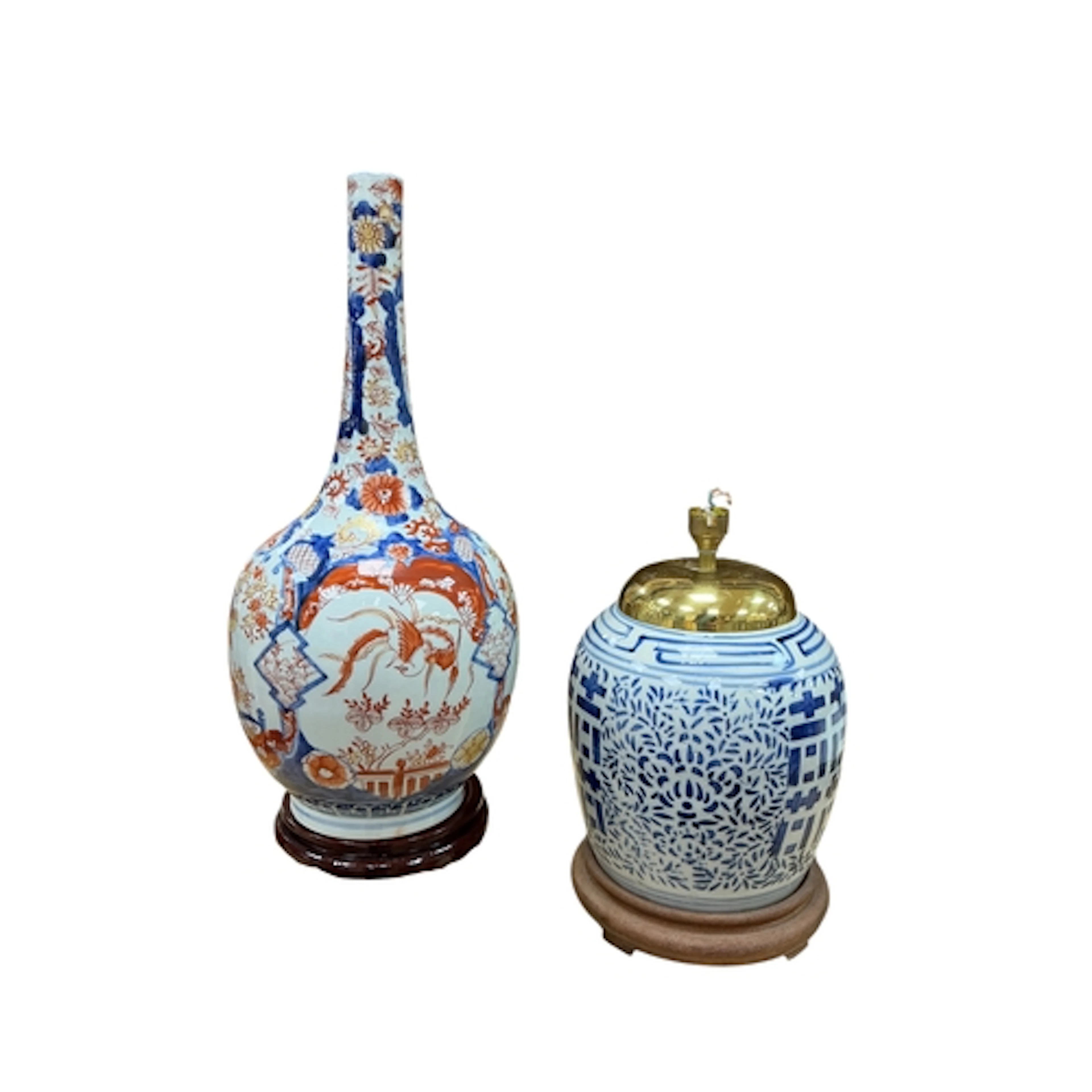 A Japanese Imari bottle vase raised on associated hardwood s...