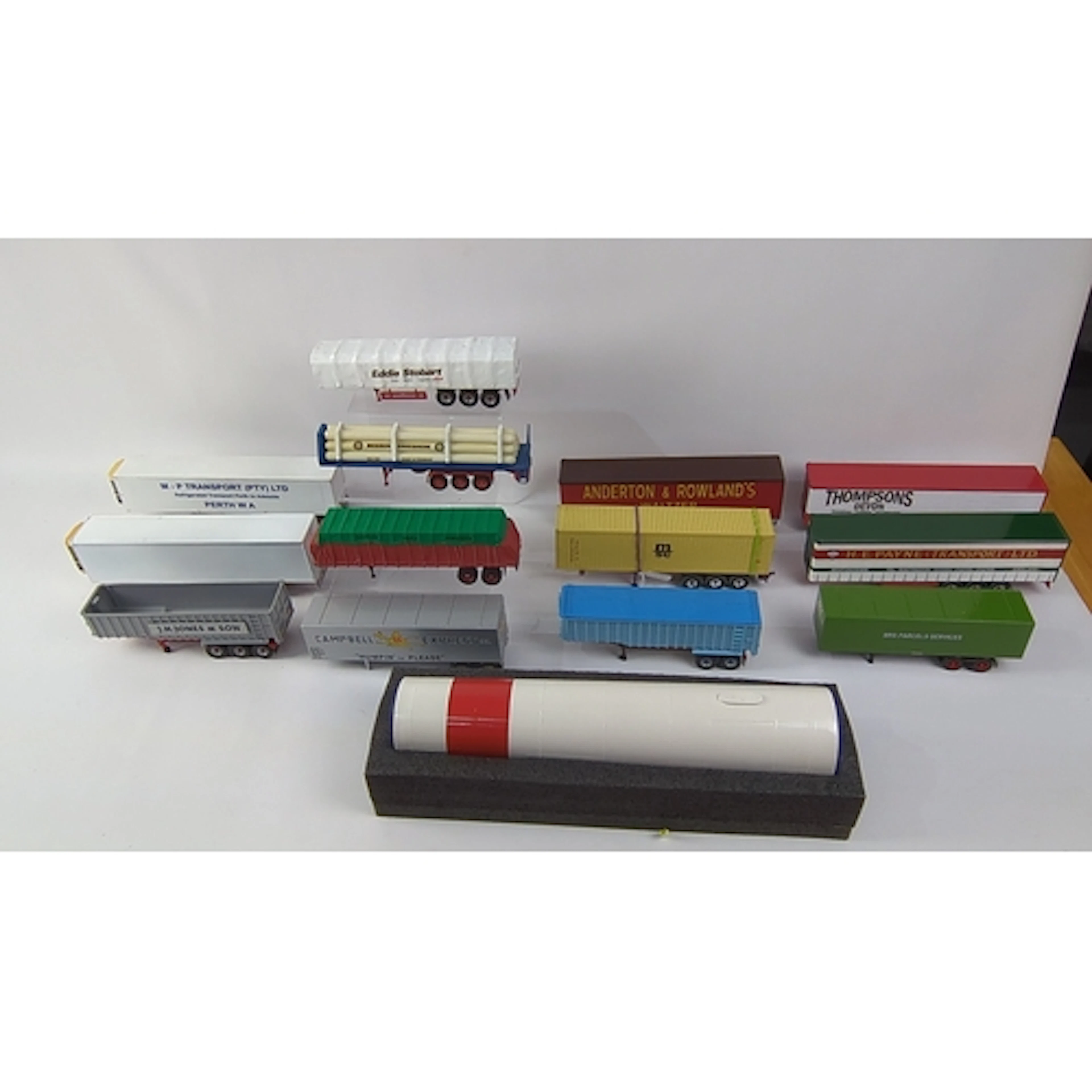 An assortment of die-cast model articulated lorry trailers, ...
