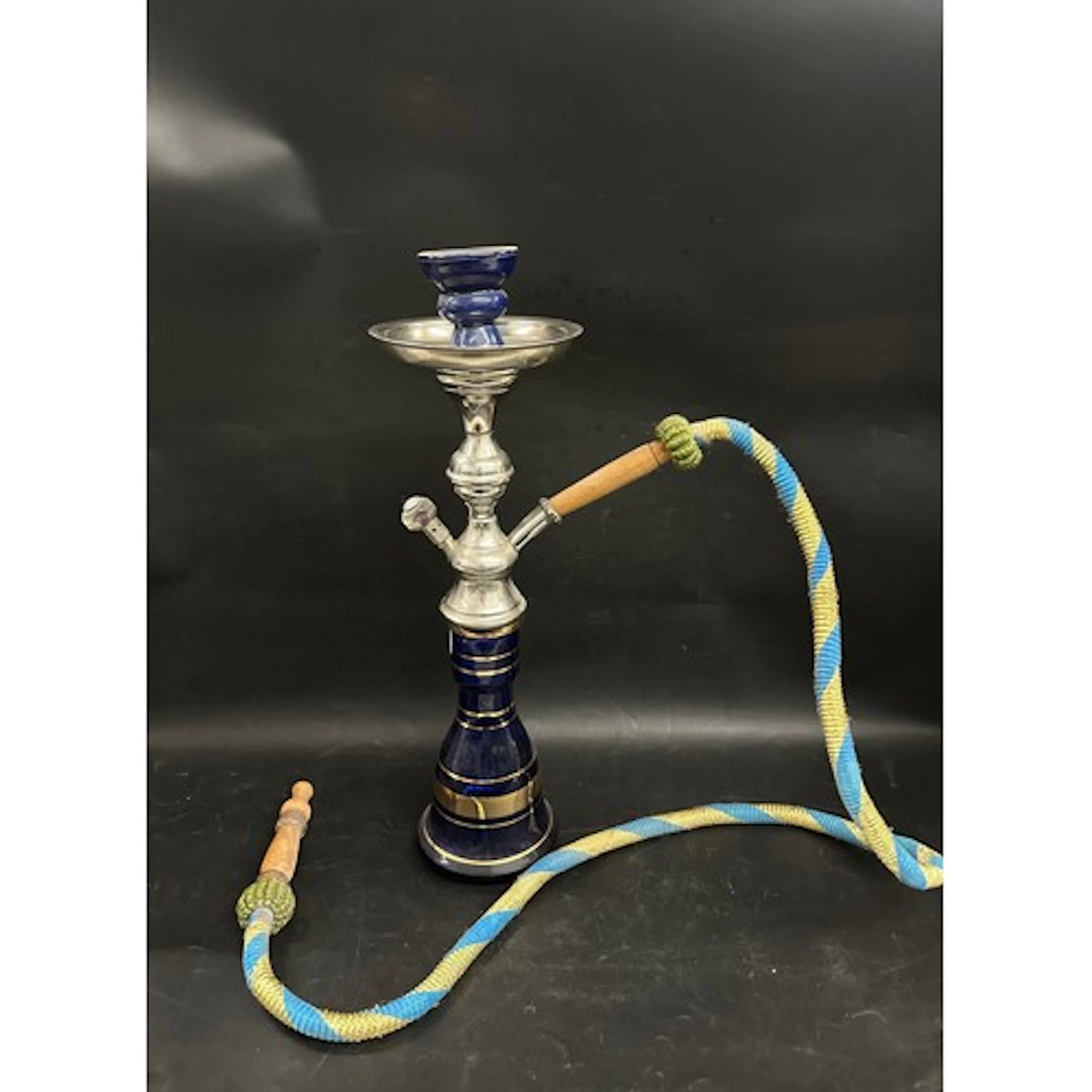 An antique Sisha pipe with blue glass base and a collection ...