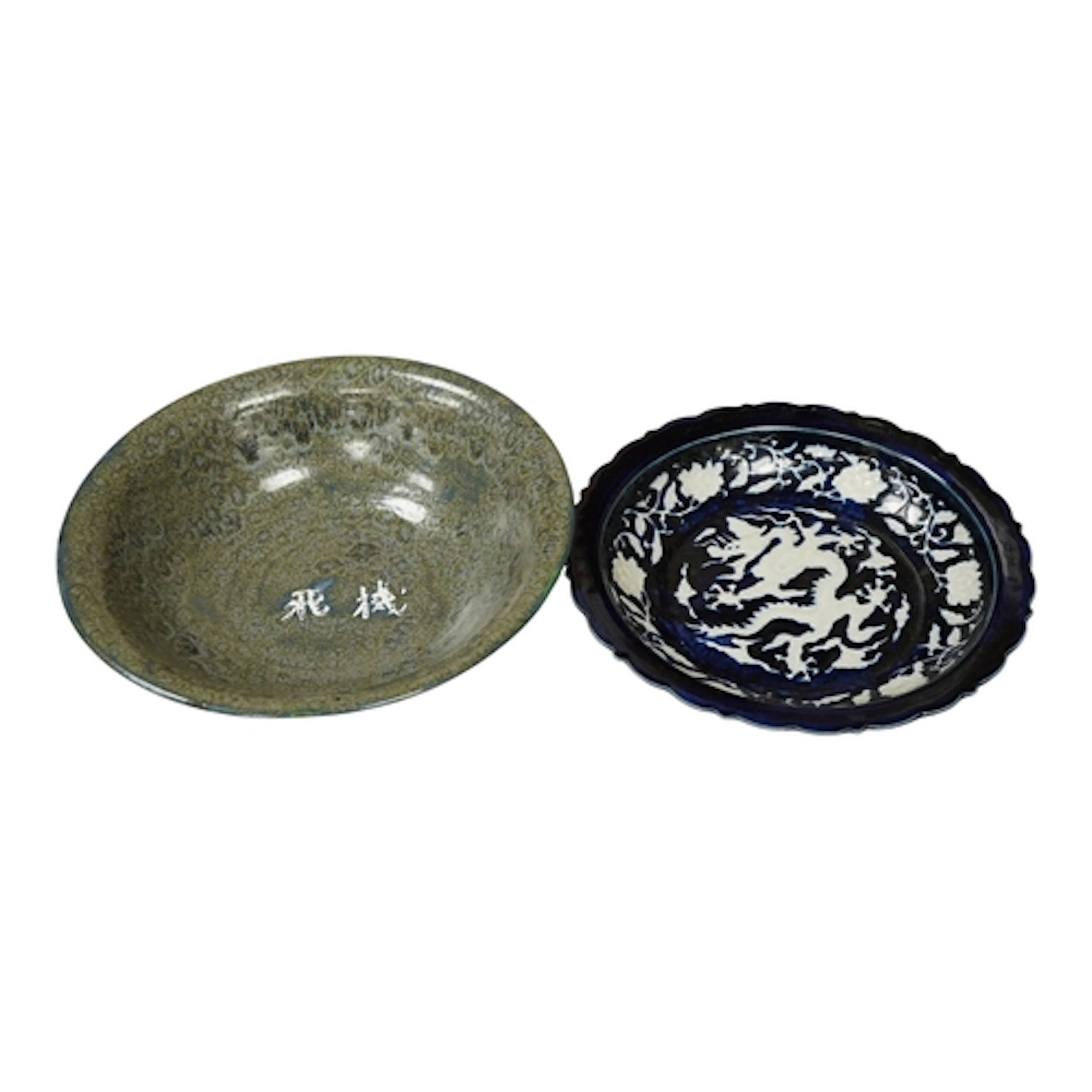 A Chinese cobalt blue and white slip decorated 'dragon' dish...