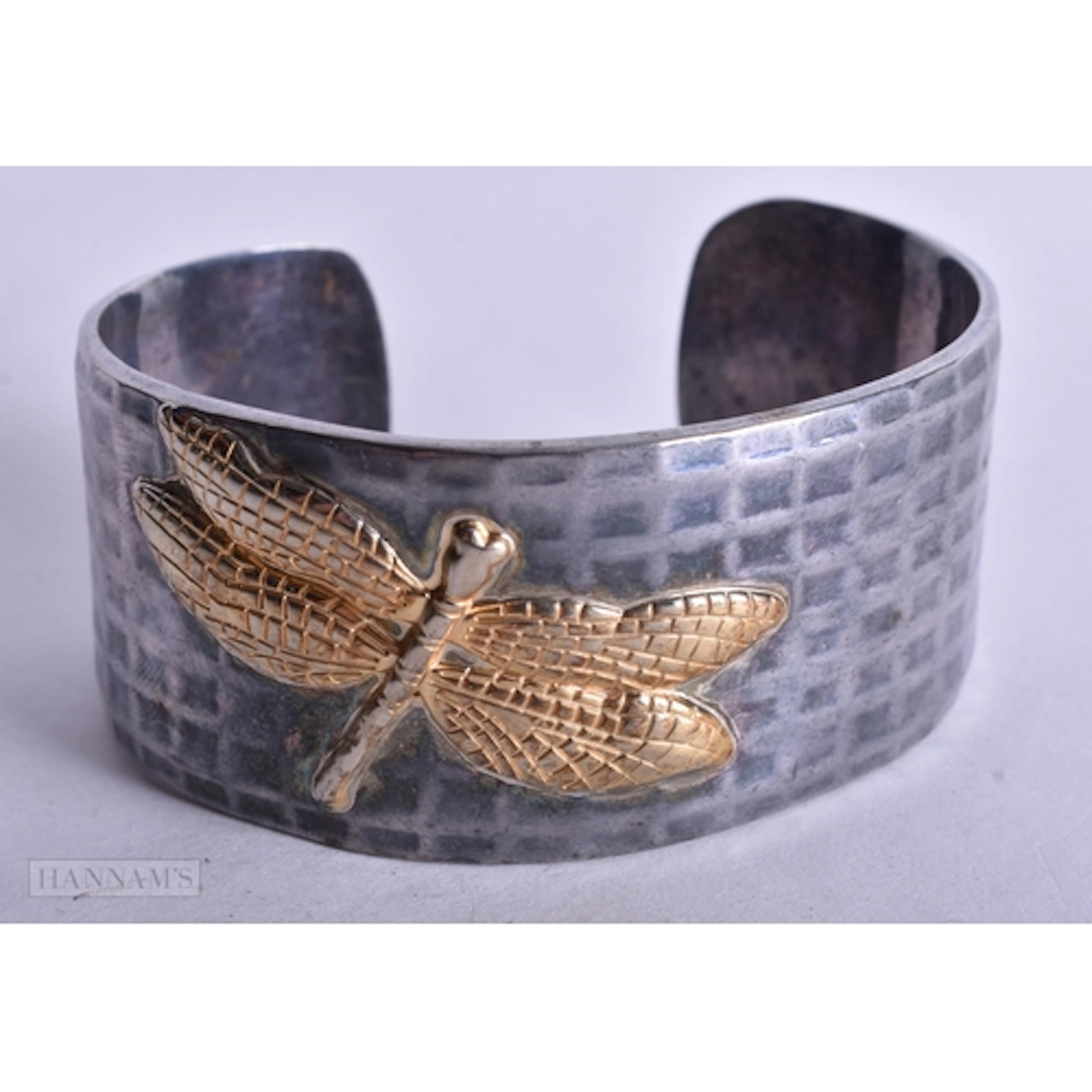 A TIFFANY & CO SILVER AND 18CT GOLD DRAGONFLY BRACELET. 68.1...