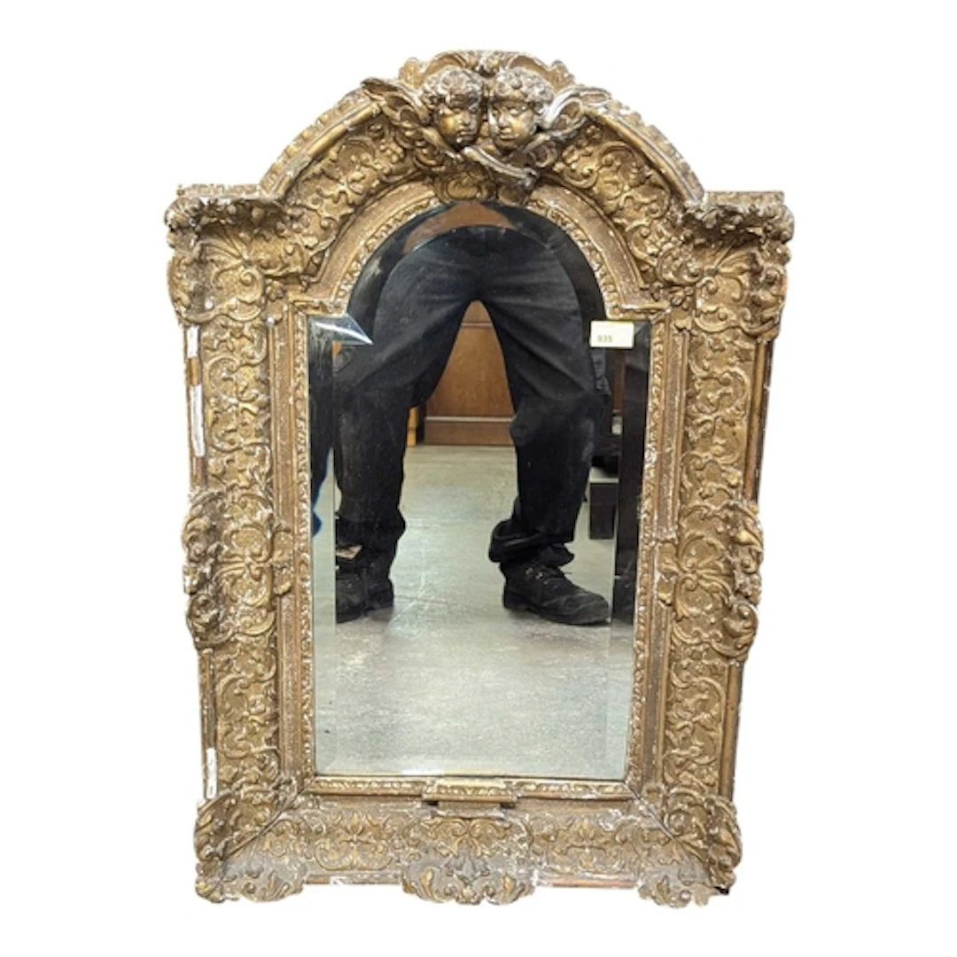 A 19th century French gilt gesso wall mirror. The mirror hav...