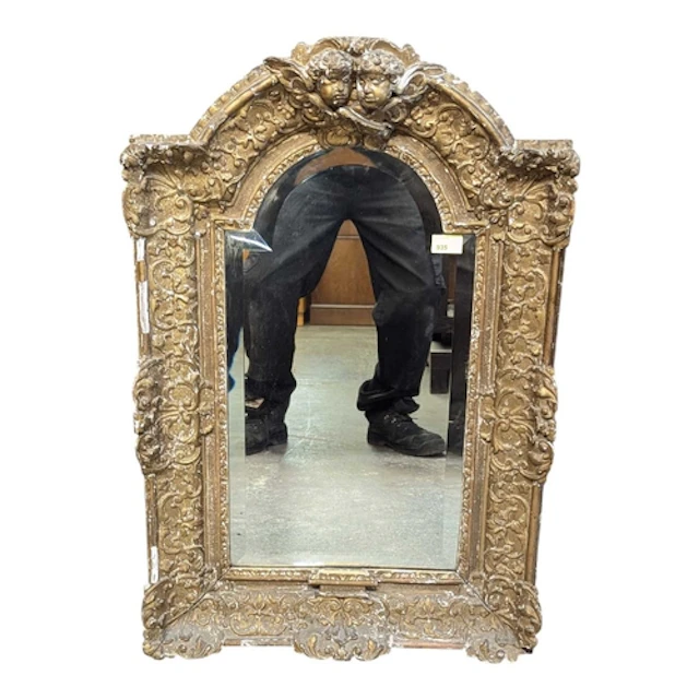 A 19th century French gilt gesso wall mirror. The mirror hav...