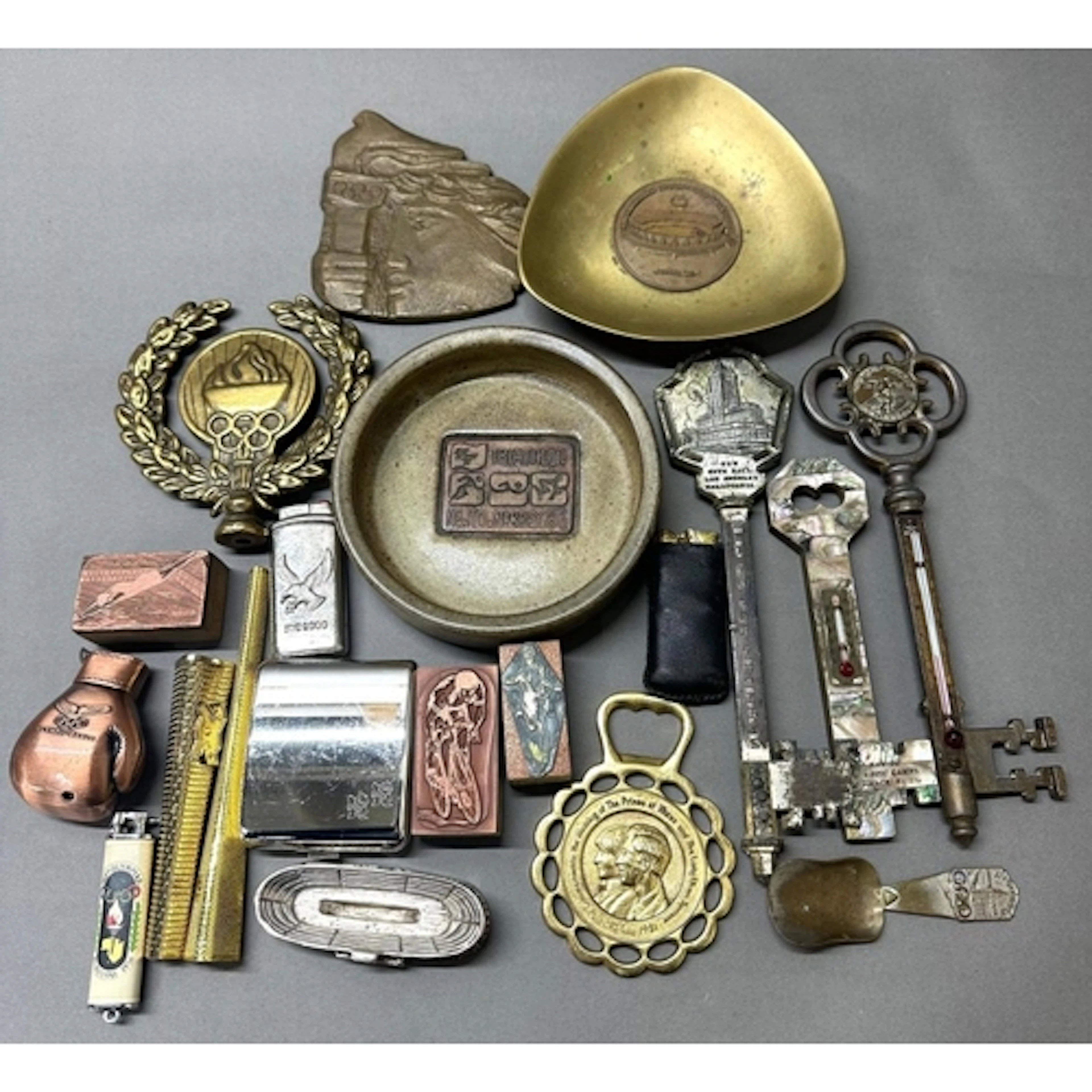 A selection of Olympic games memorabilia to include, an asht...