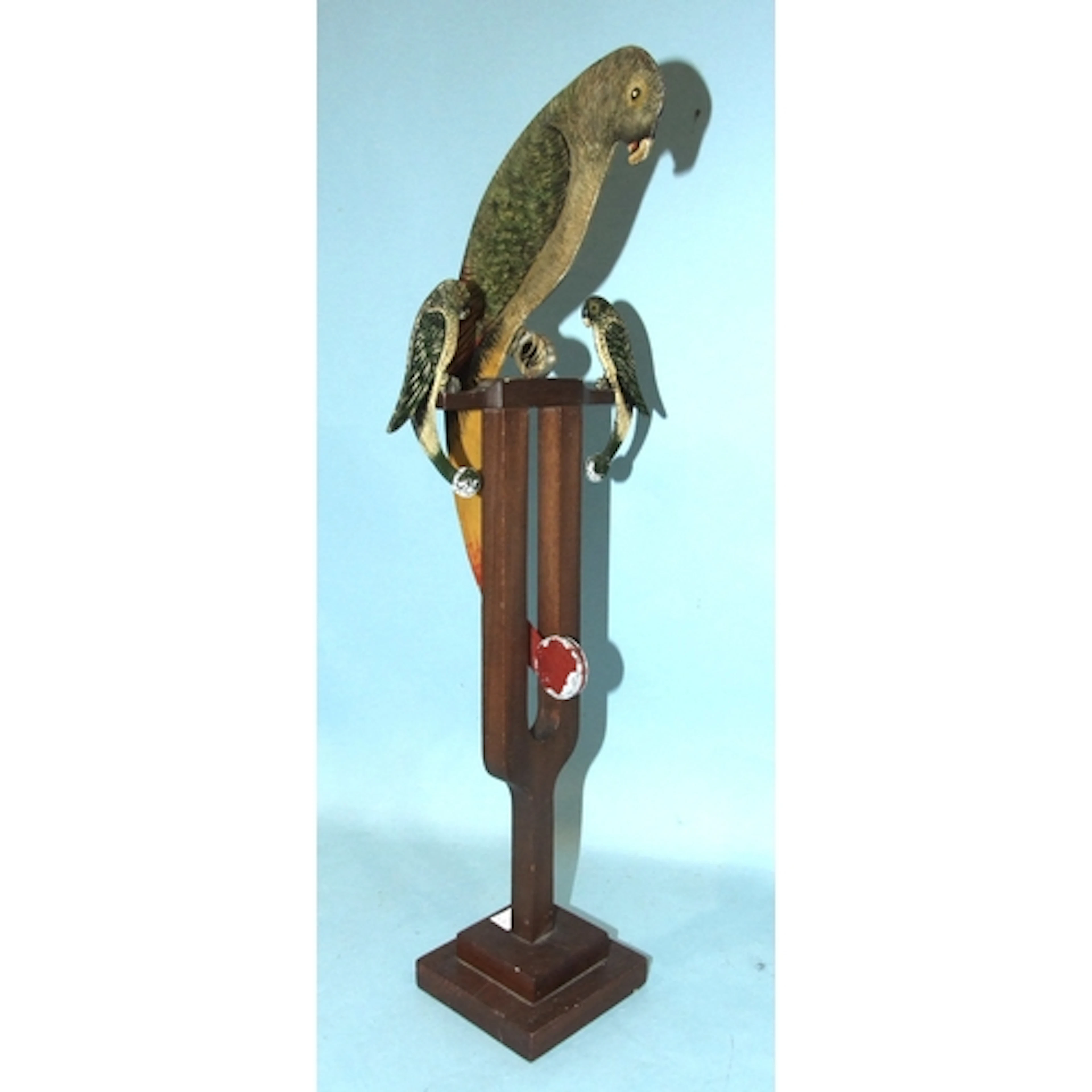 A vintage rocking parrot toy, the three hand-painted birds u...