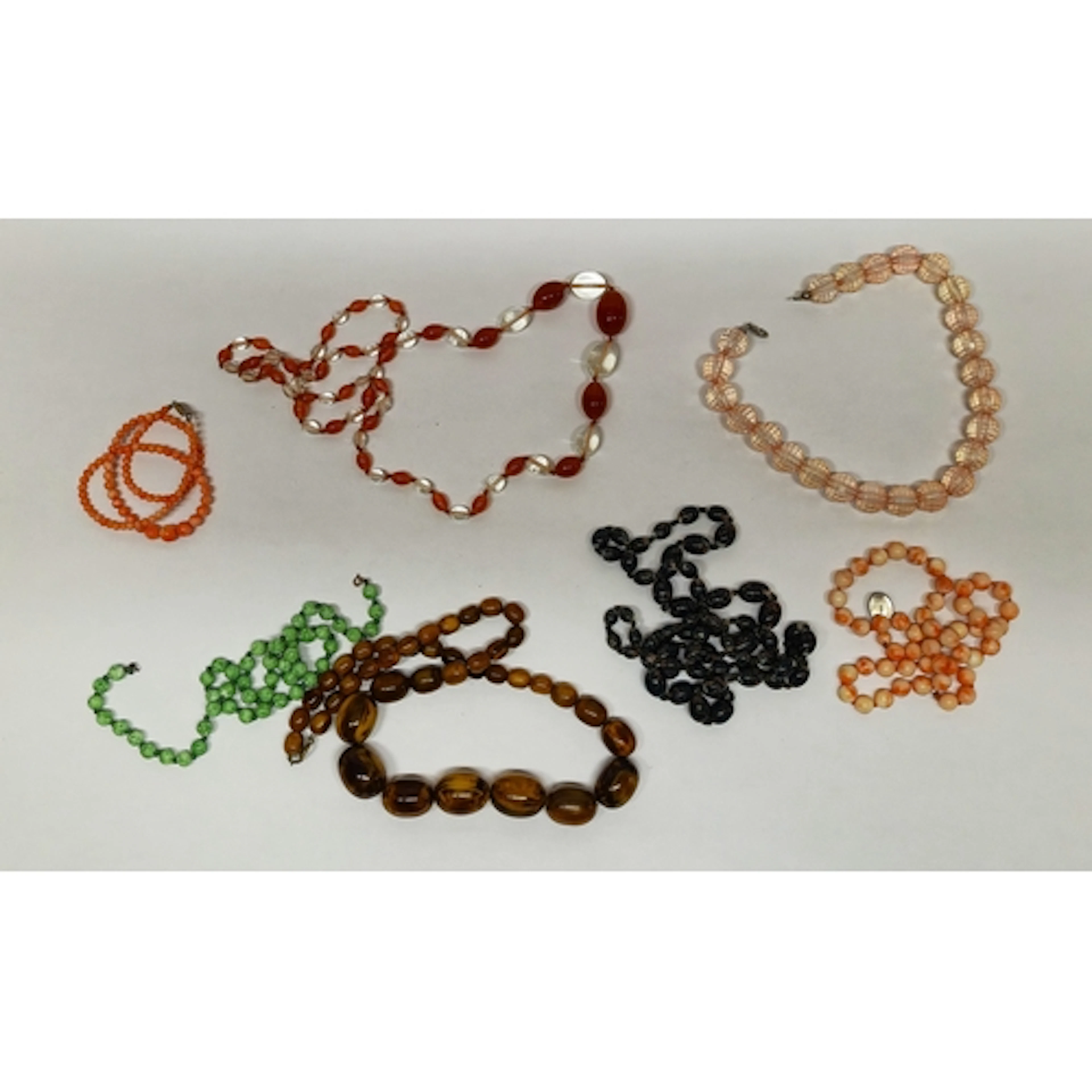Group of strings of bead necklaces to include a coral and mo...
