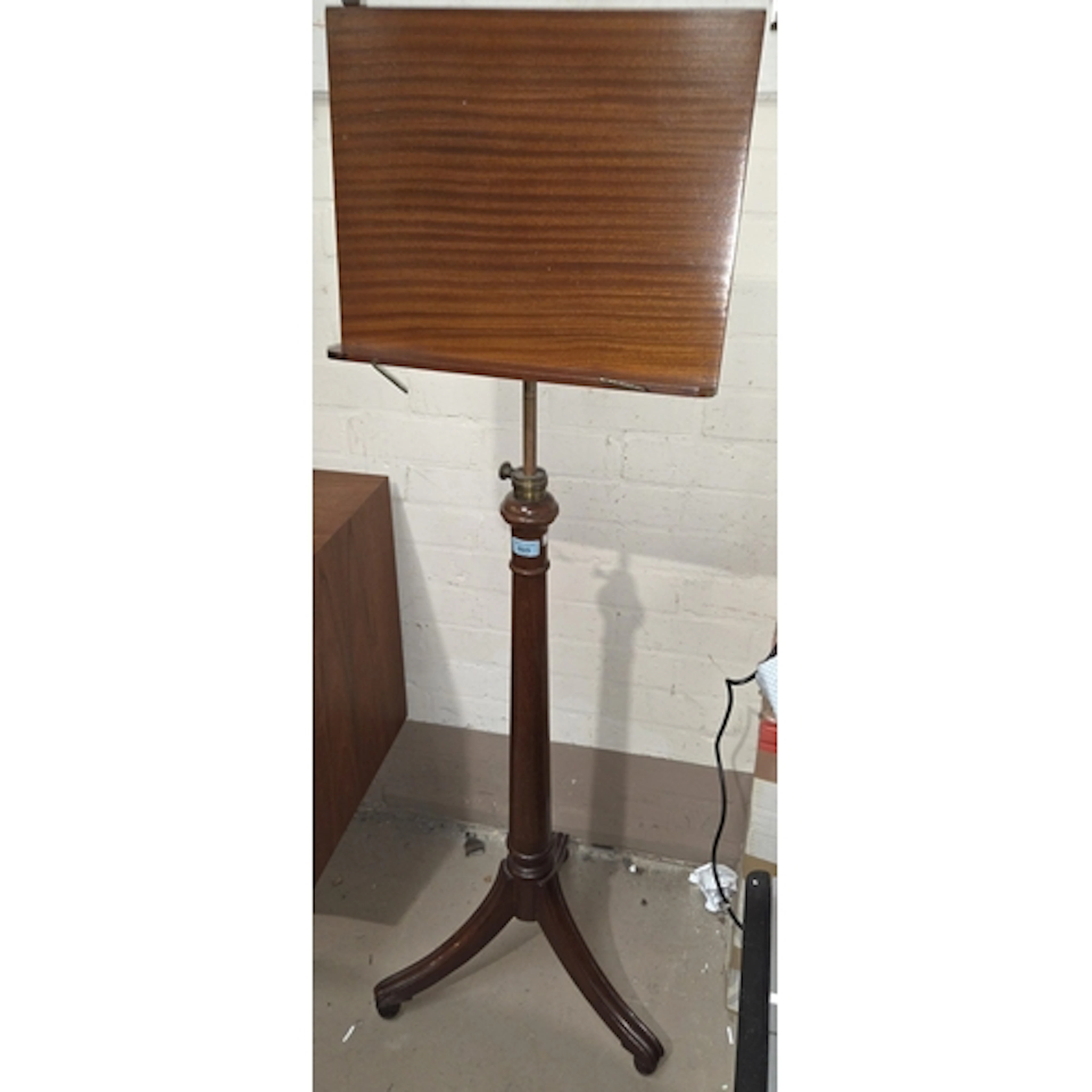 A 19th century mahogany and brass rise and fall music stand ...