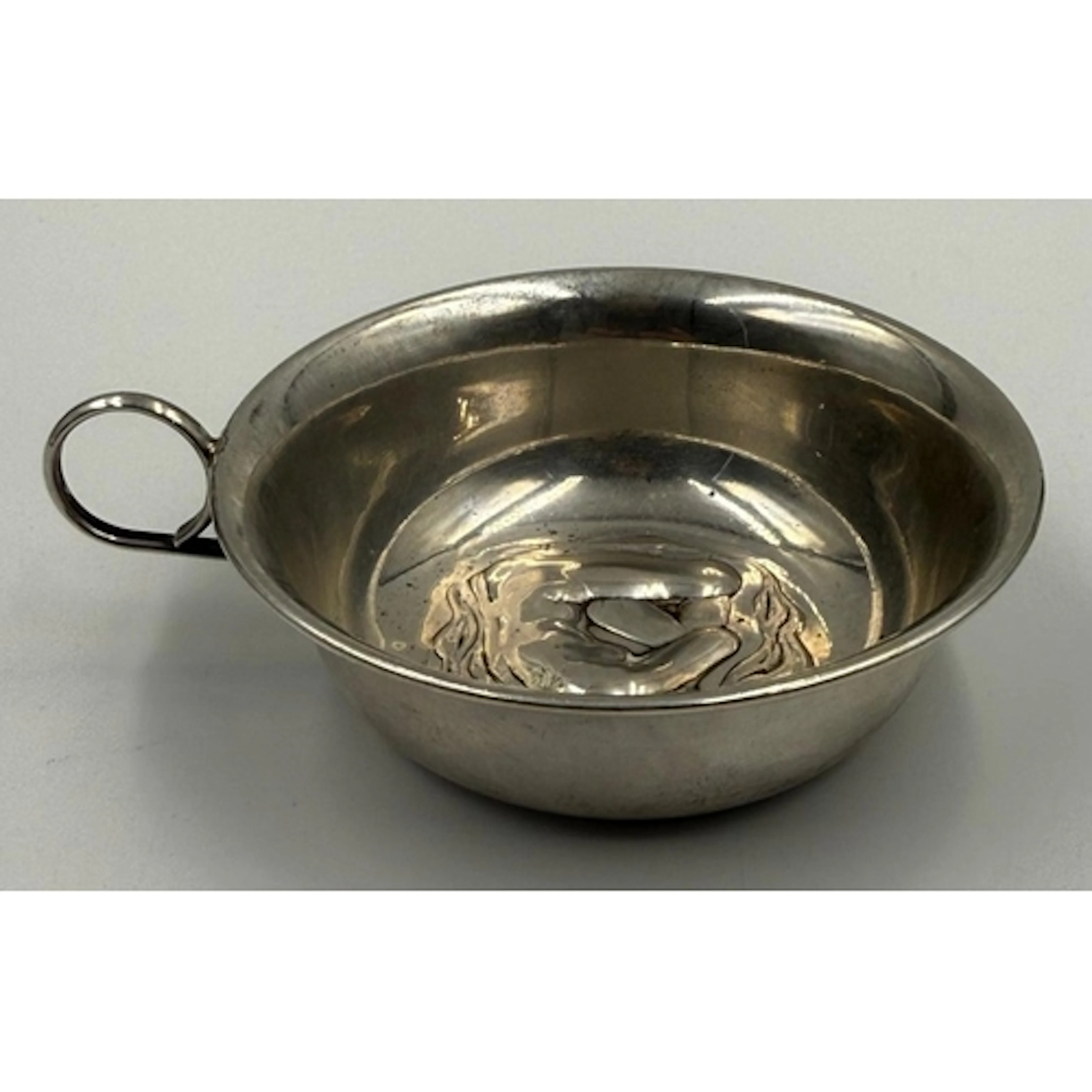 A silver art nouveau taste vin marked 800 with central nymph...