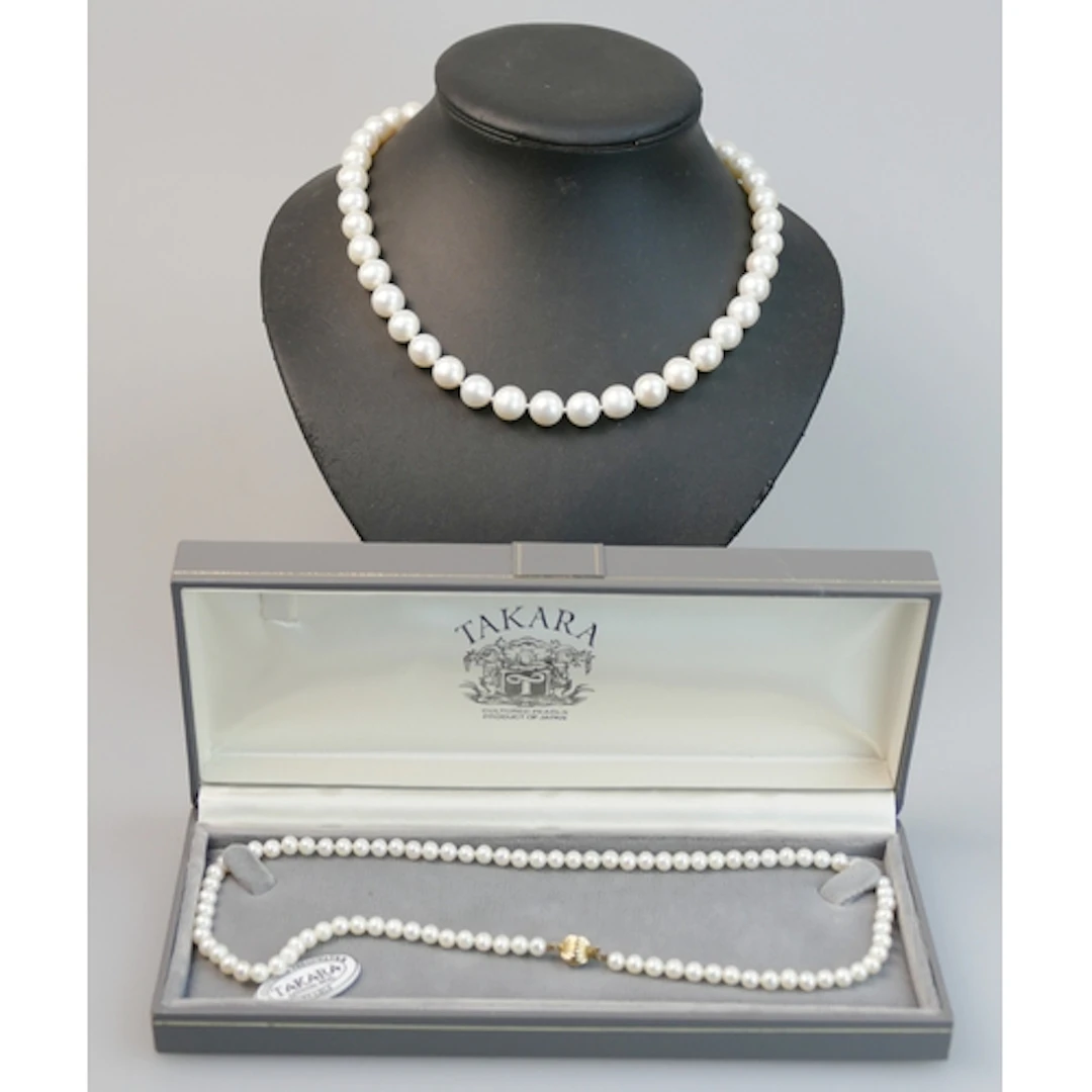 A large cultured pearl necklace with an 18ct yellow gold cla...