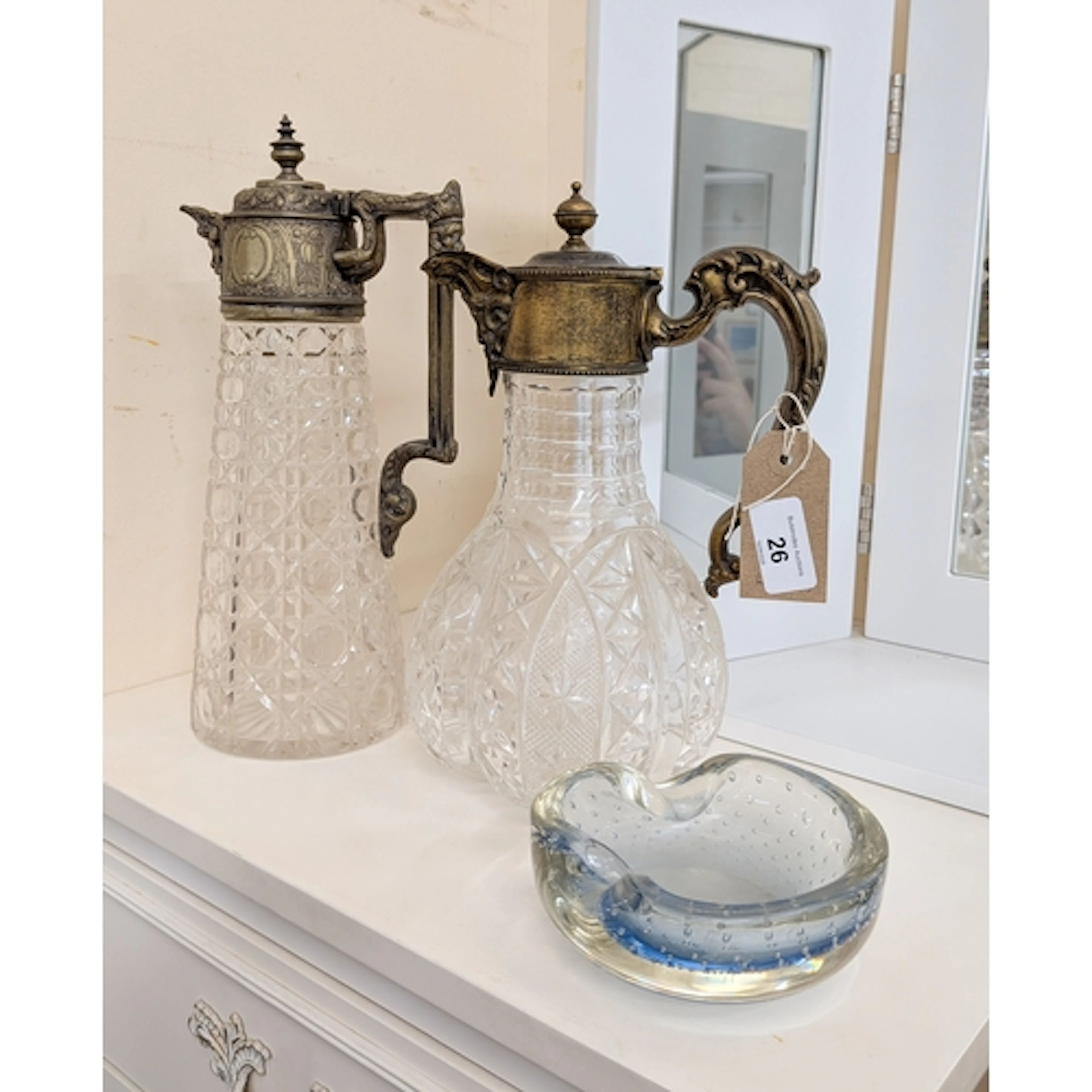 Two cut glass and silver plated decorated claret jugs and a ...