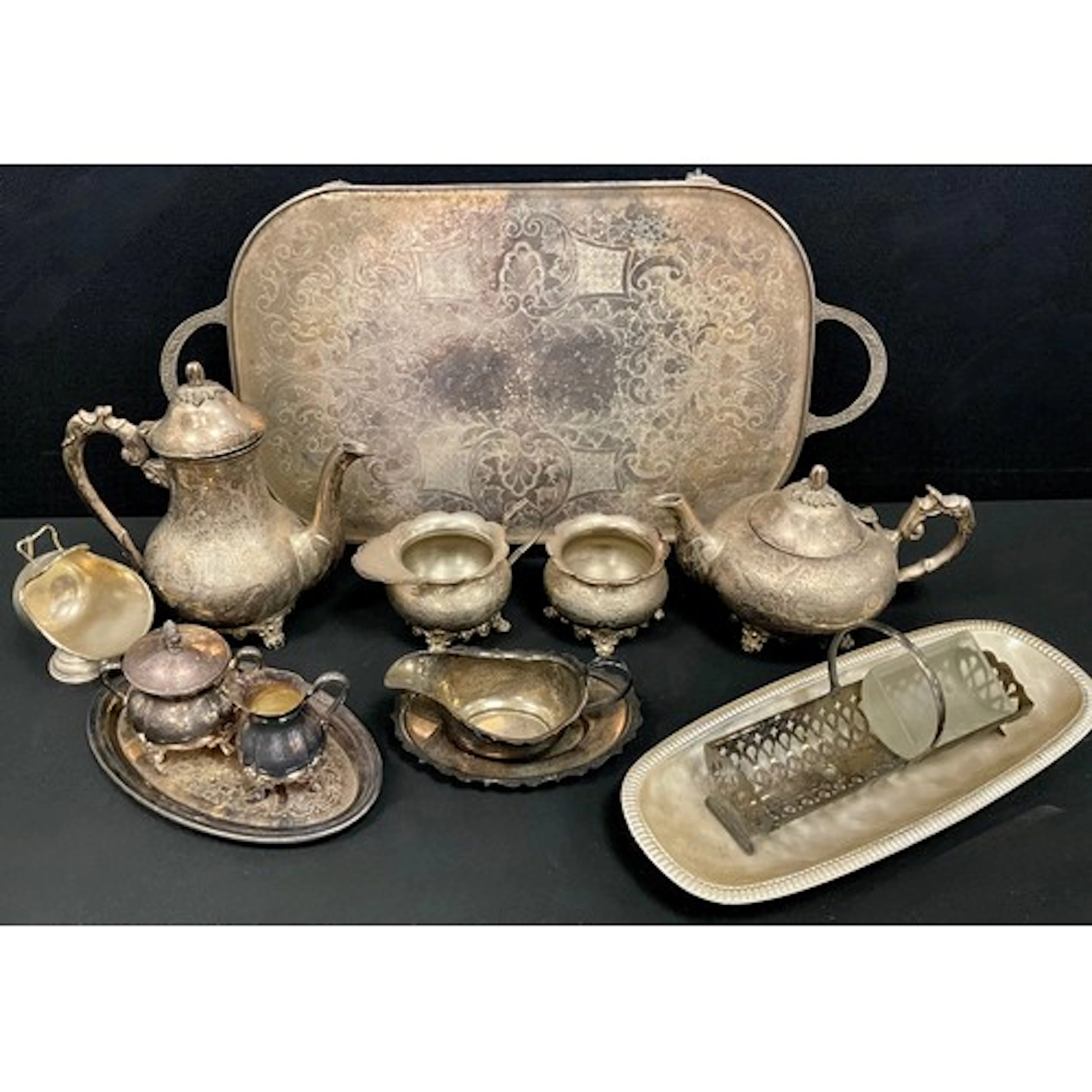 A silver plated four piece tea set on tray, Viners cream jug...