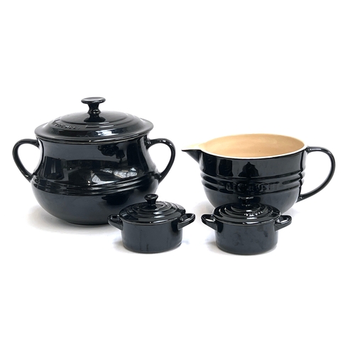 A Le Creuset black stoneware lidded casserole pot, large mix...
