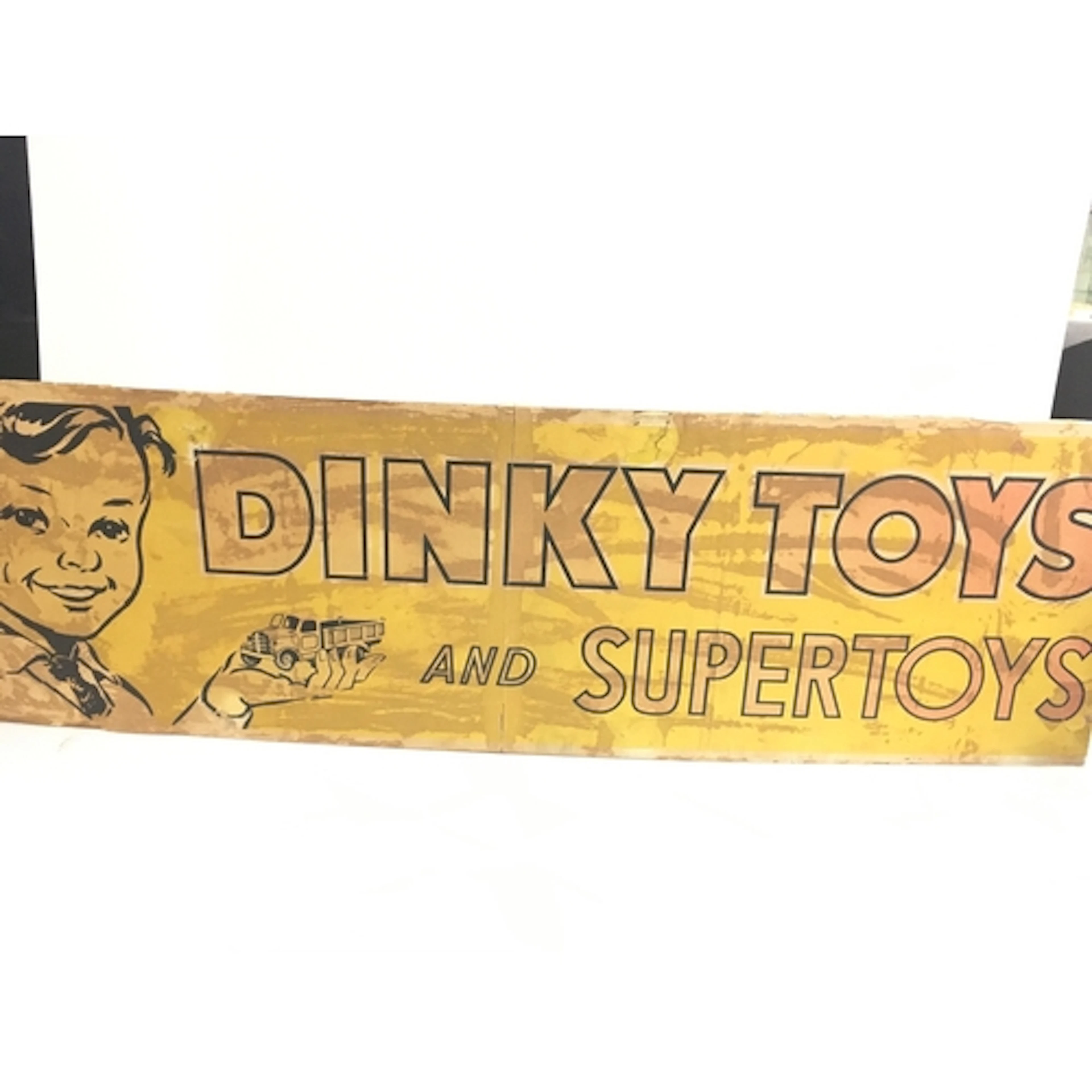 A Vintage Dinky Toys,Ply Wood Paper Backed Shop Sign. Approx...