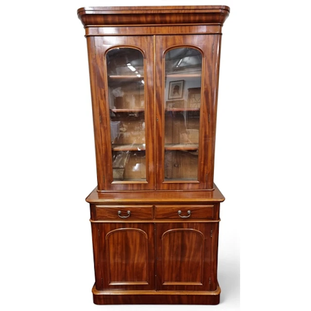 Of superb quality. A mid 19th Century Mahogany two door Book...