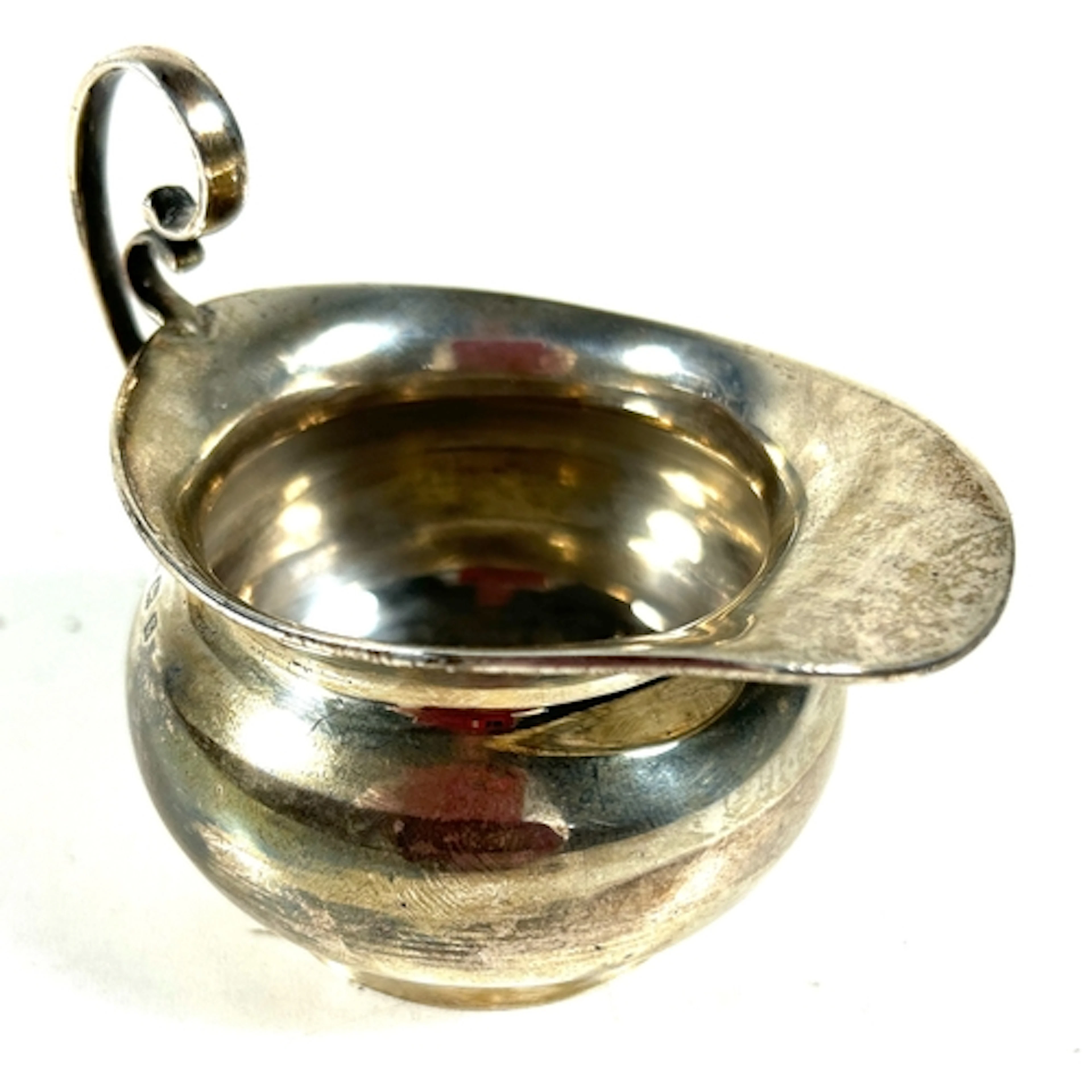 A small silver creamer/ milk jug. B'ham 1906, by T.W. Weight...