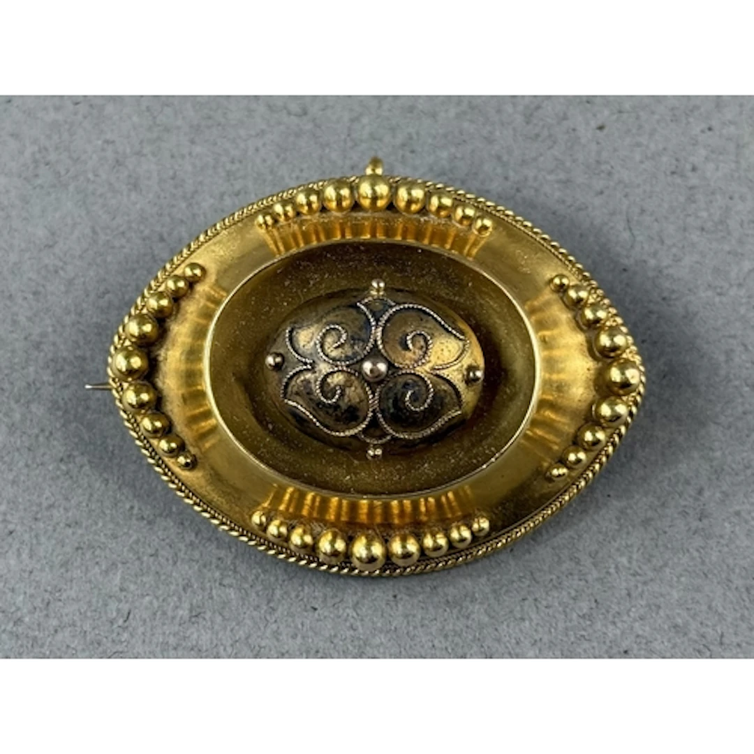 Jewellery: a 19th century yellow metal mourning brooch of na...