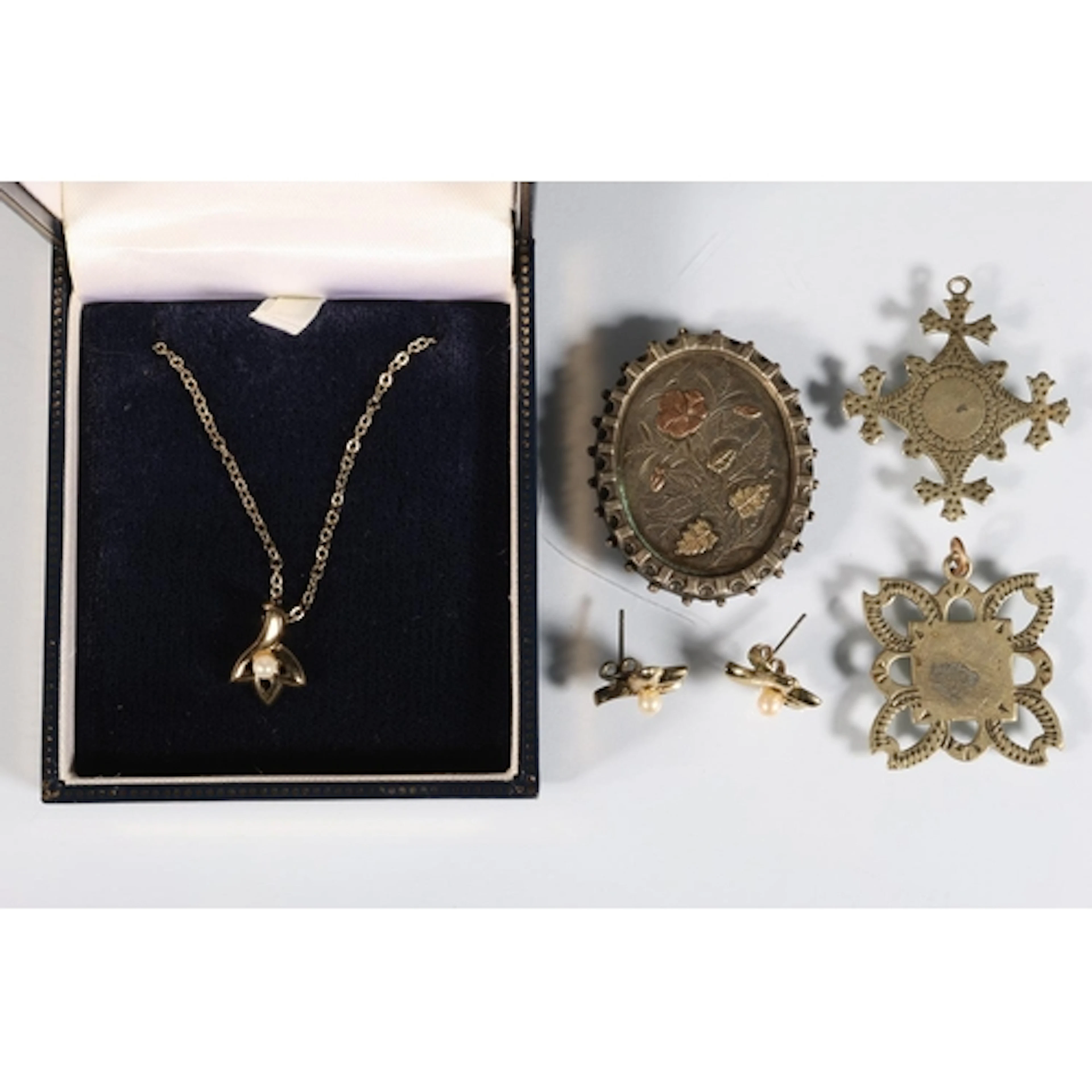 Gold plated pendant on chain set with pearl and a pair of ma...