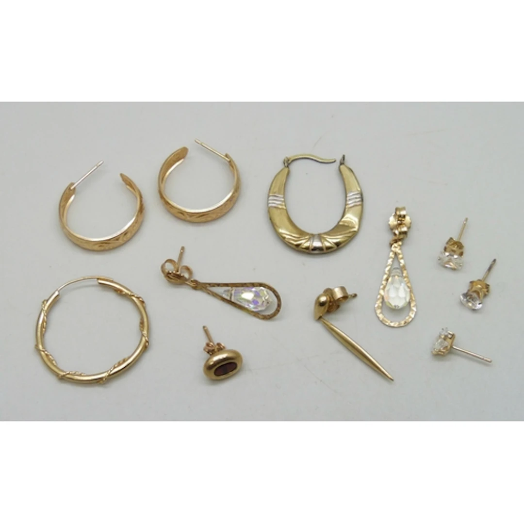 A collection of 9ct gold and yellow metal earrings, 5.5g tot...