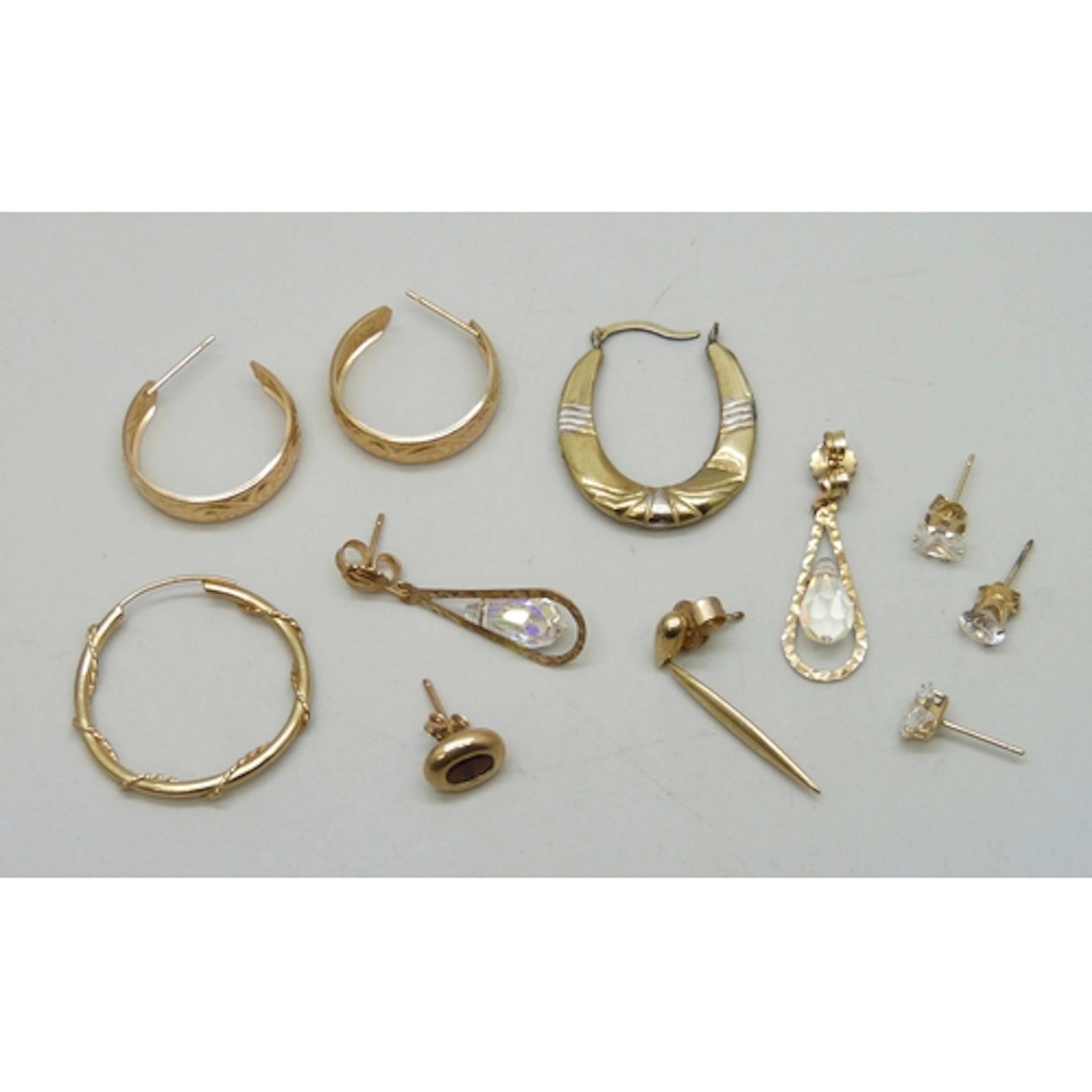A collection of 9ct gold and yellow metal earrings, 5.5g tot...