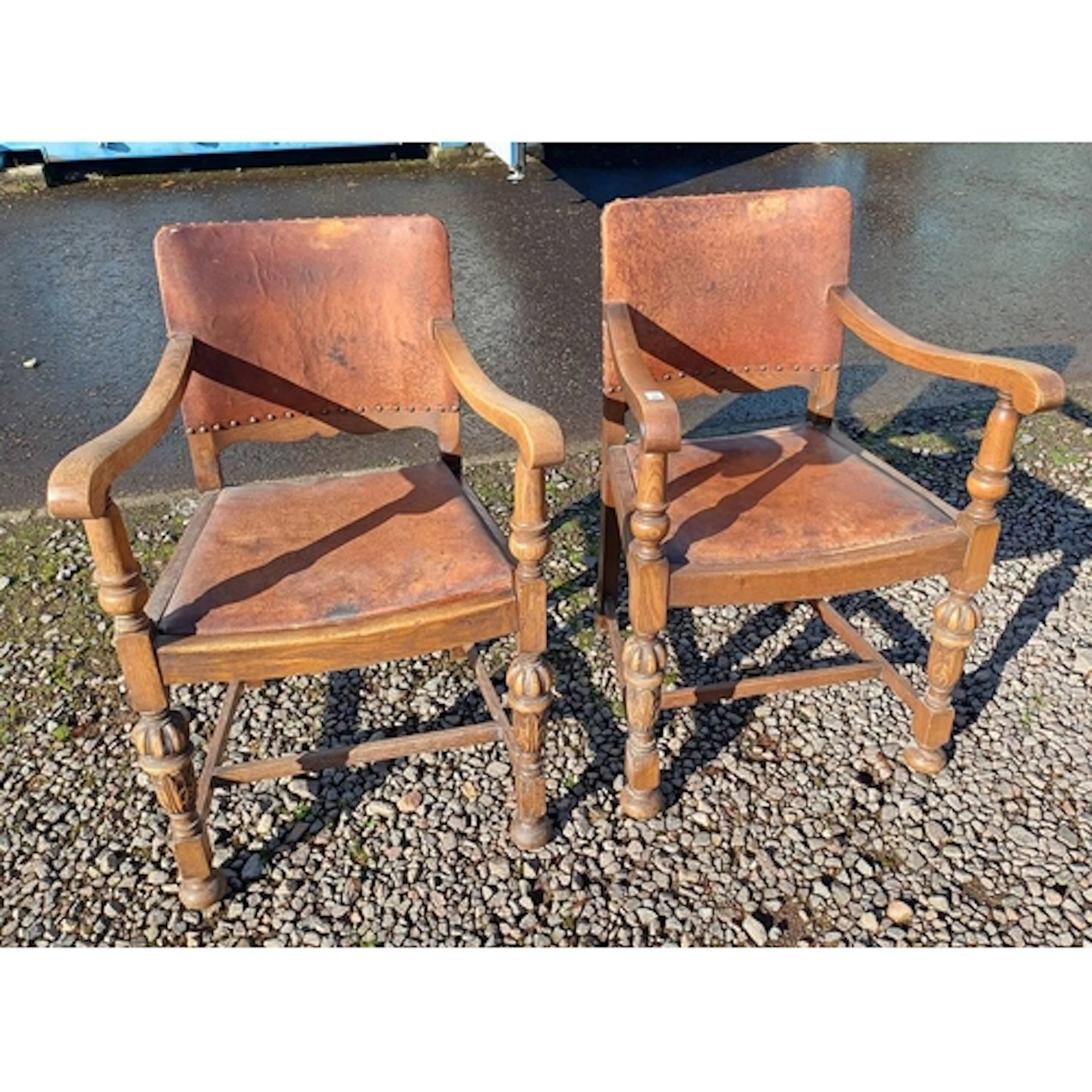 PAIR OF EARLY-MID 20TH CENTURY OAK OPEN ARMCHAIRS WITH LEATH...