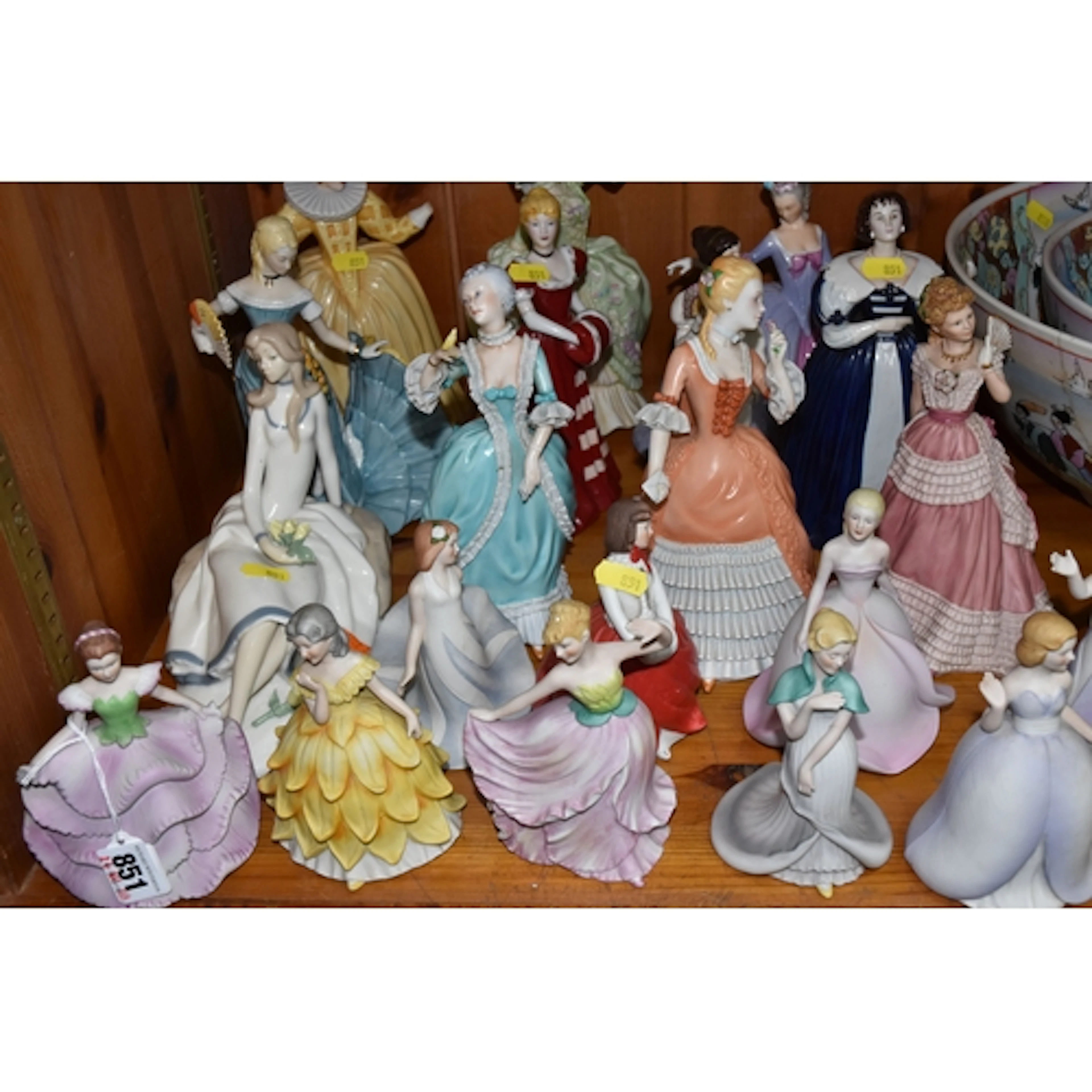 A LARGE GROUP OF BOTH GLAZED AND BISQUE FEMALE FIGURINES to ...