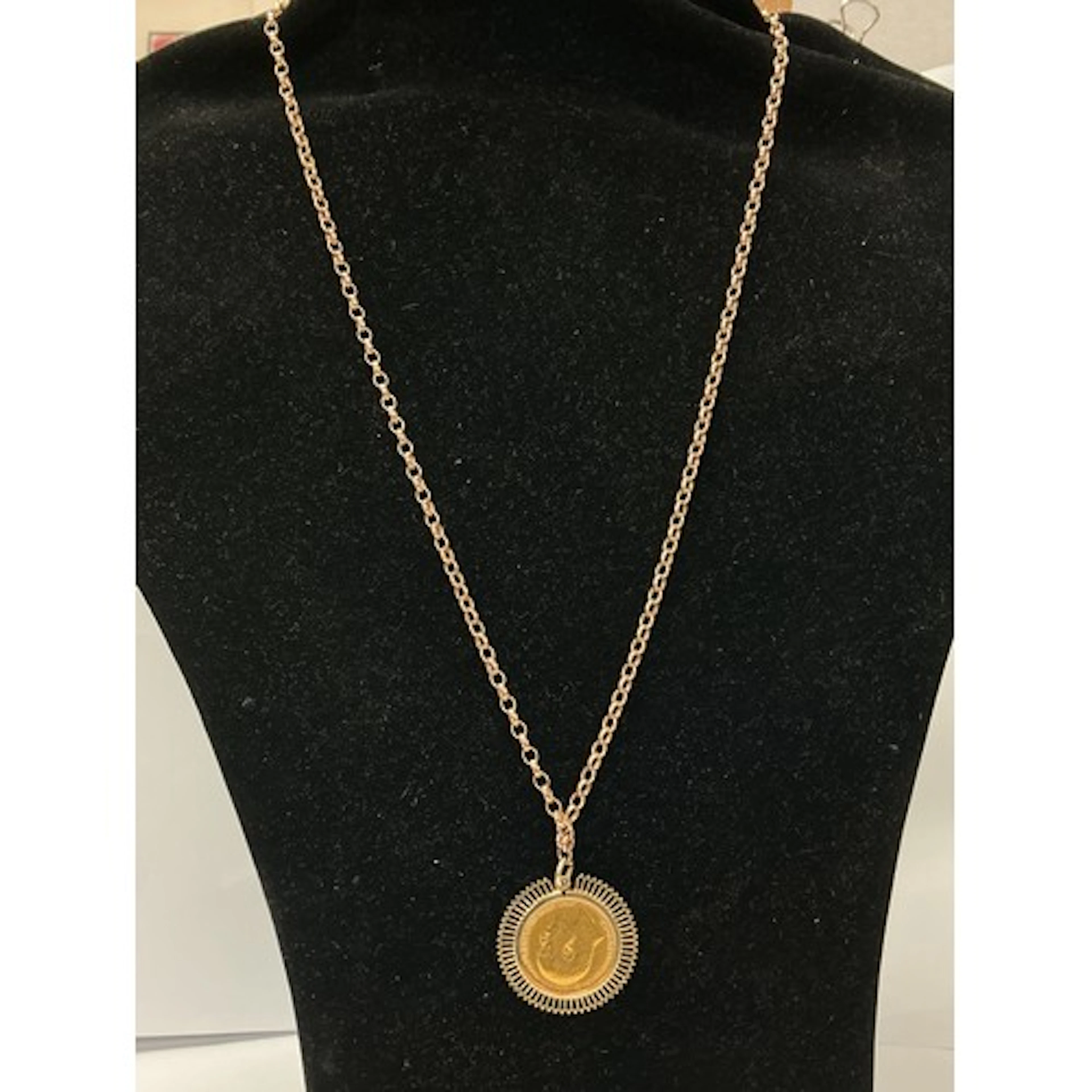 A 1908 Edwardian gold sovereign on rose gold belcher chain. ...