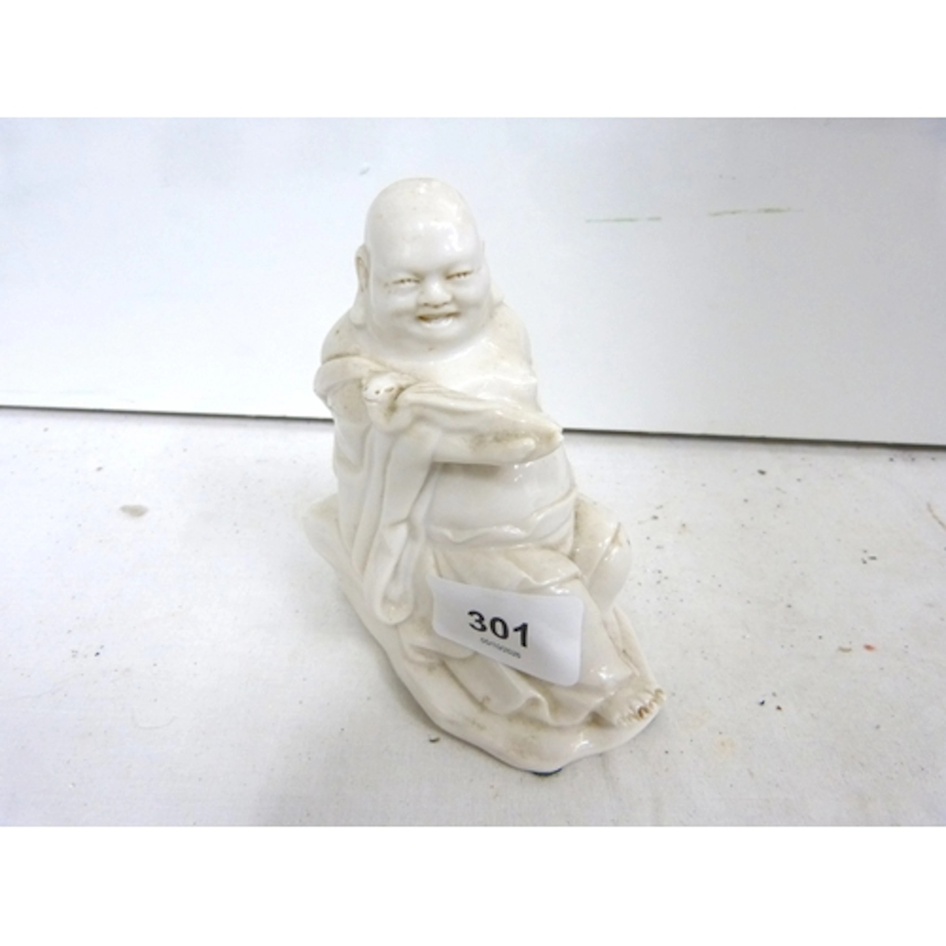 Chinese Blanc de China laughing Buddha figure.