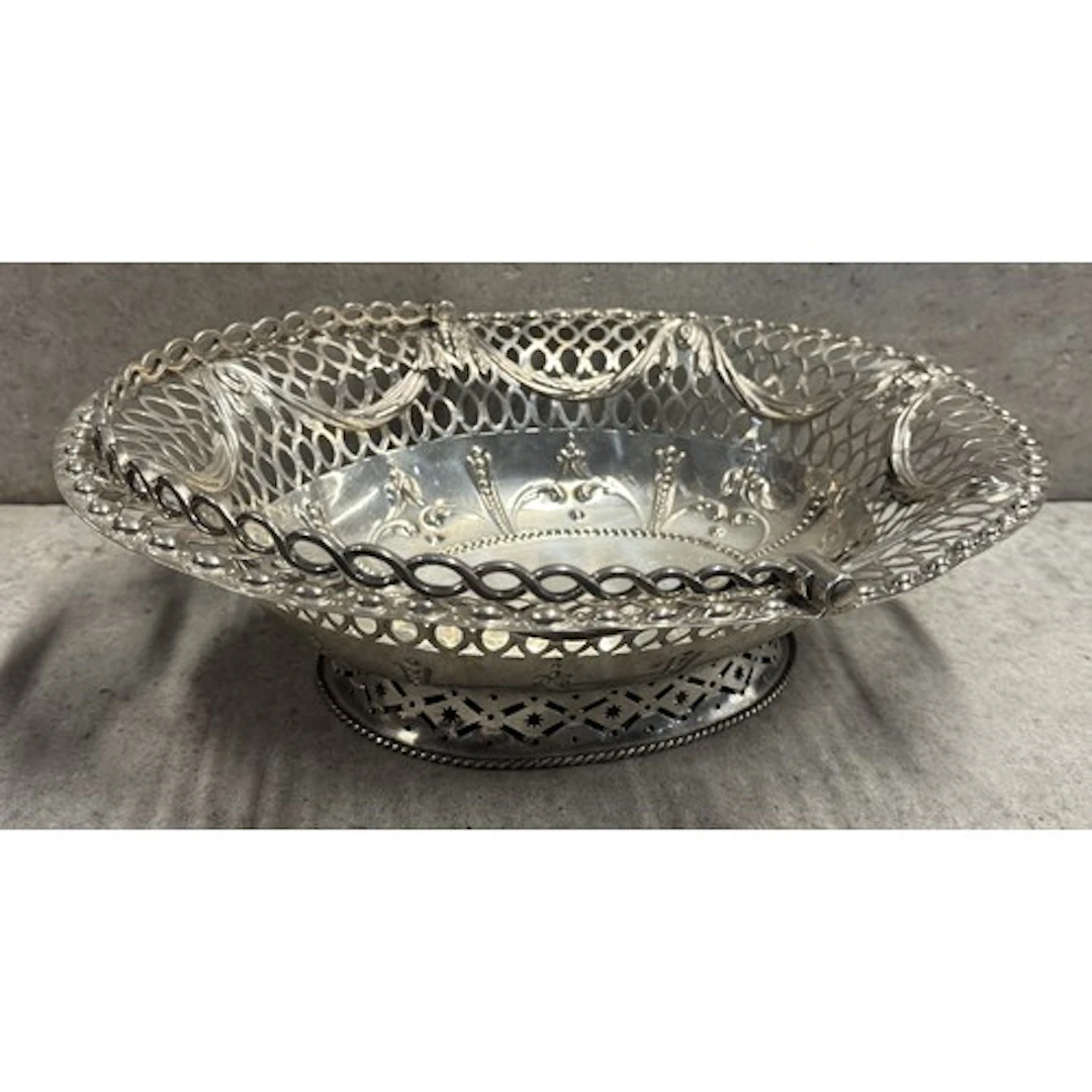 An18th Century George III silver swing handled basket with p...
