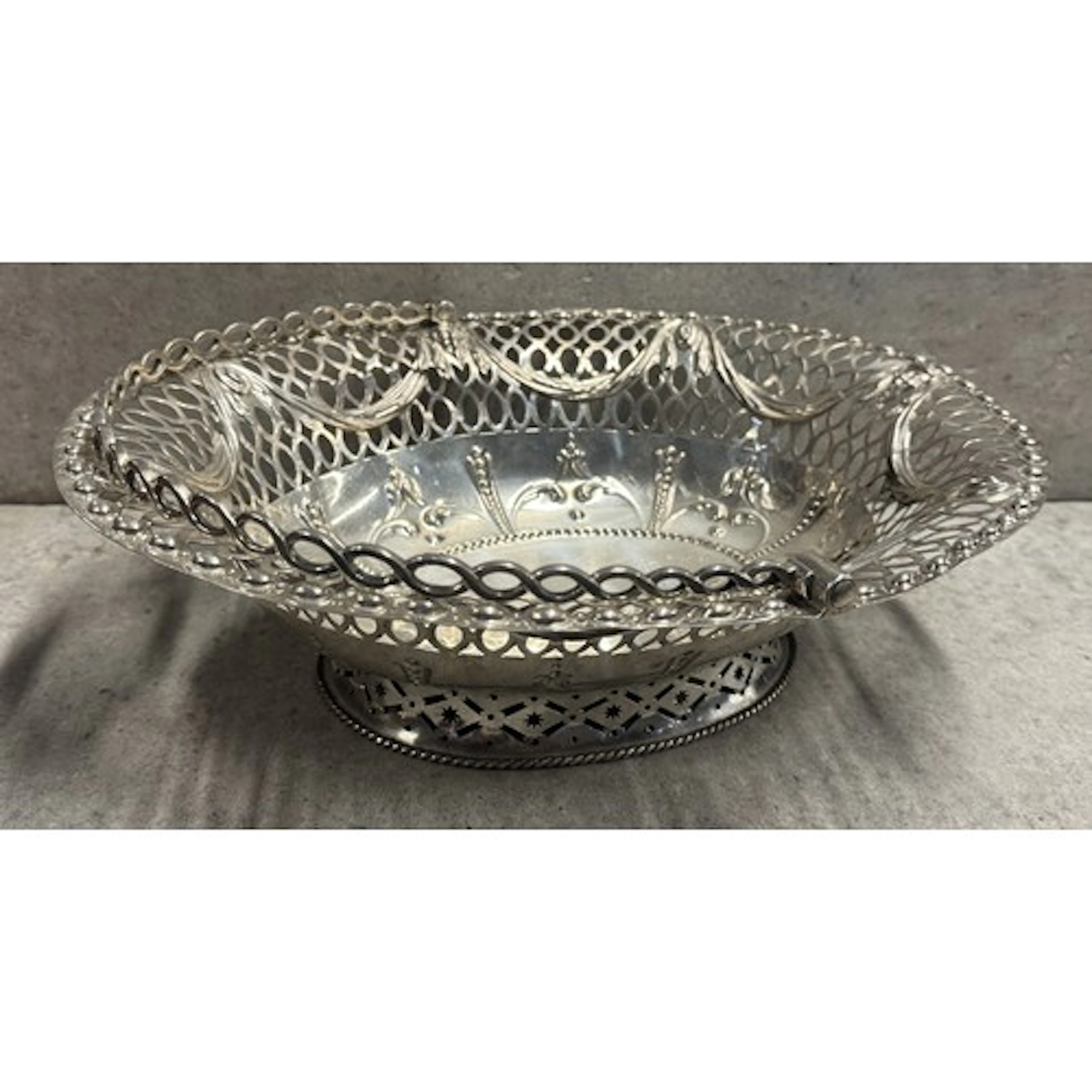An18th Century George III silver swing handled basket with p...