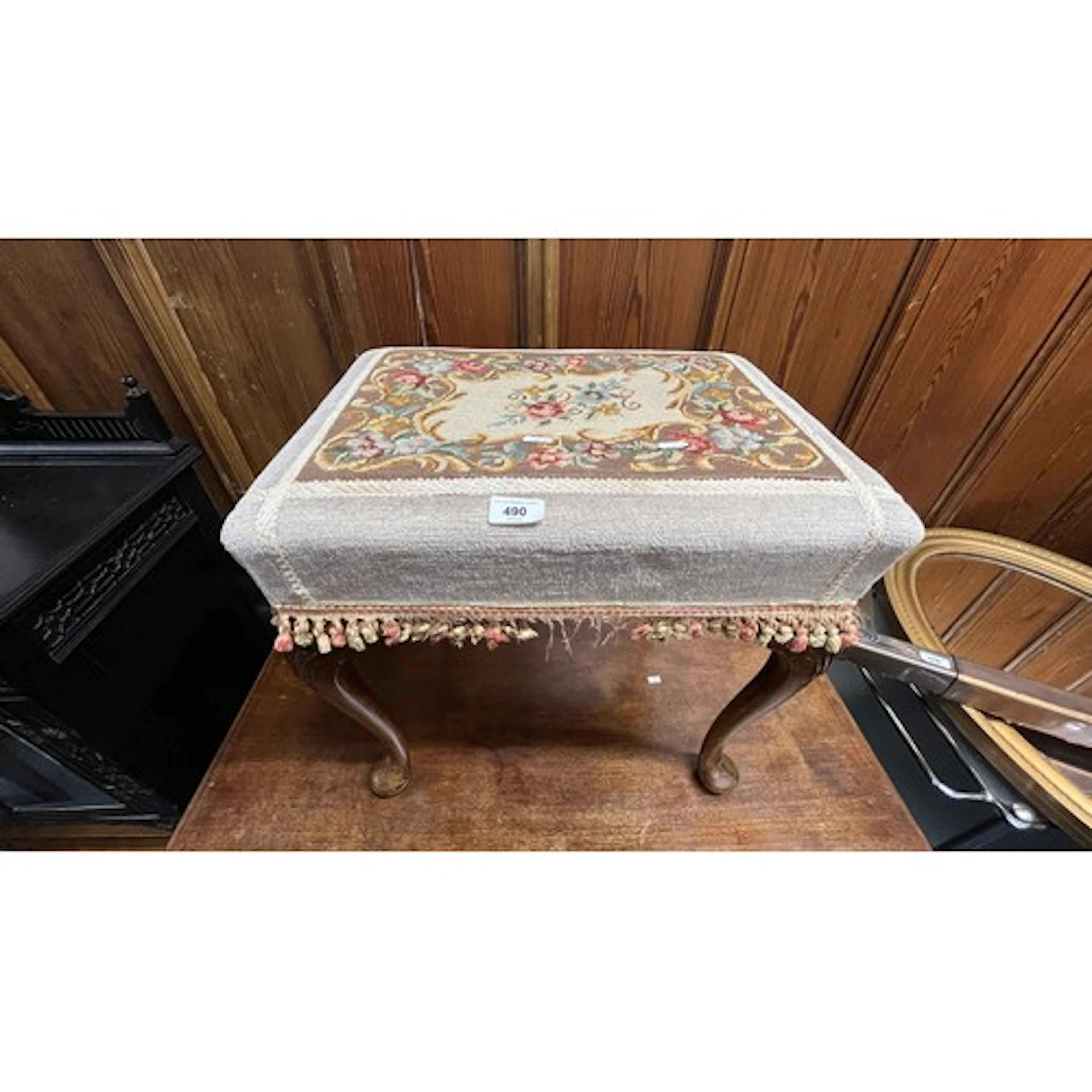 Upholstered footstool.