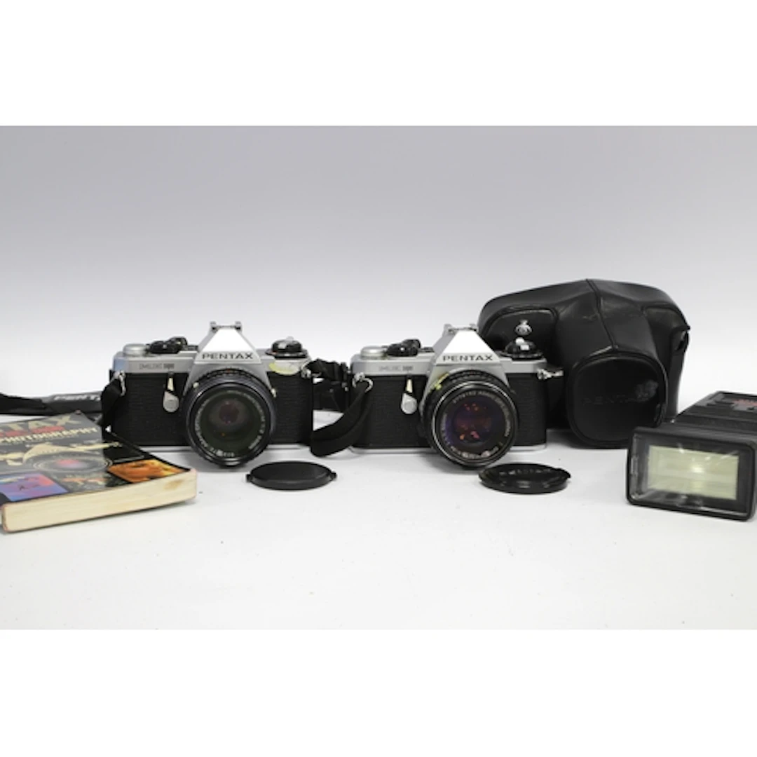 Pentax ME Super 35mm SLR Film Camera with attached SMC Penta...