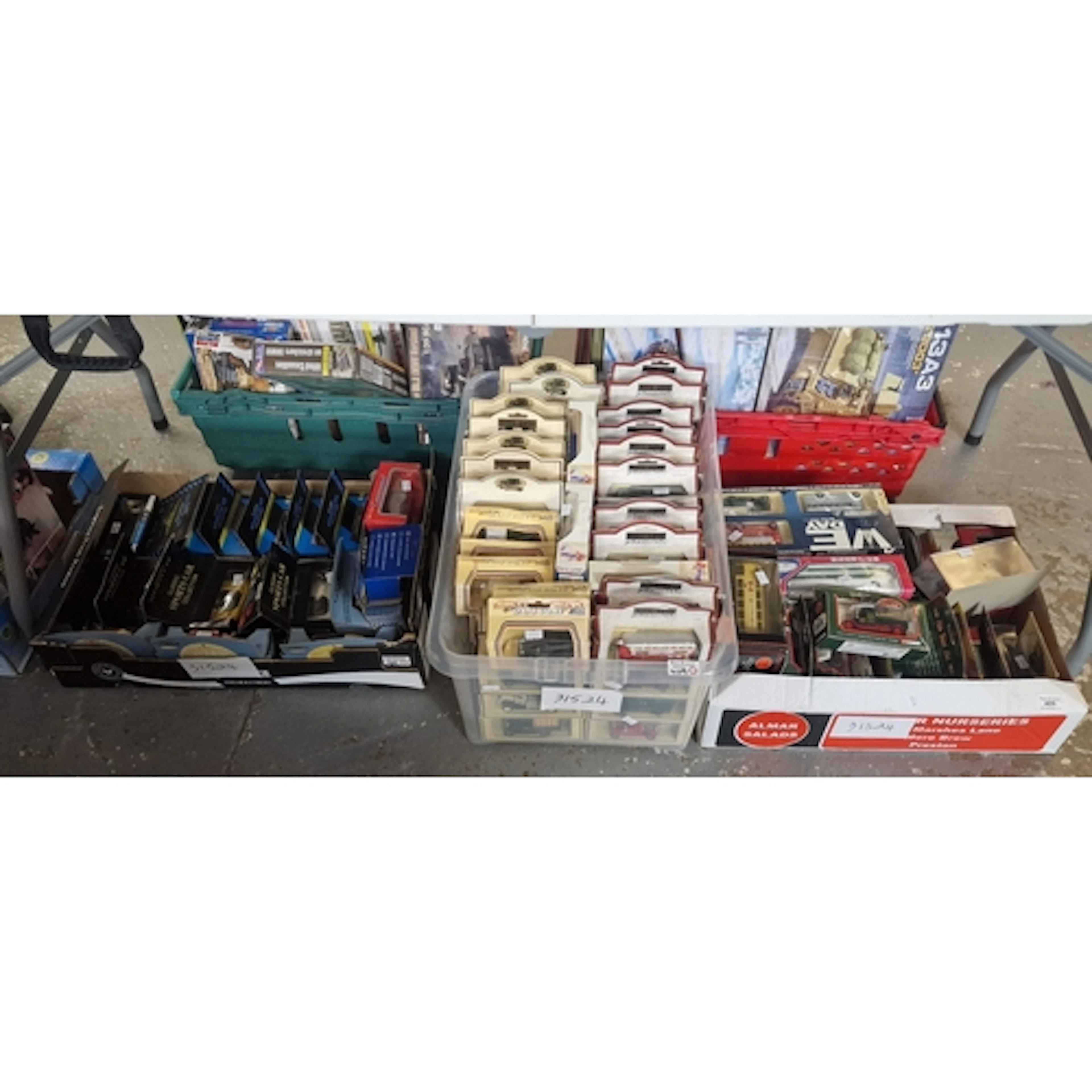 Three boxes of model vehicles in original packaging, to incl...