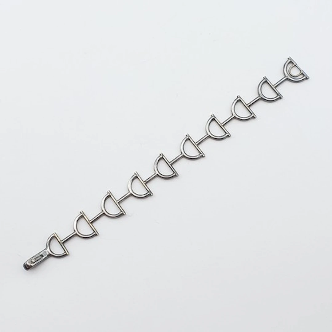 A silver folding Bracelet with horse bit design links, Sheff...