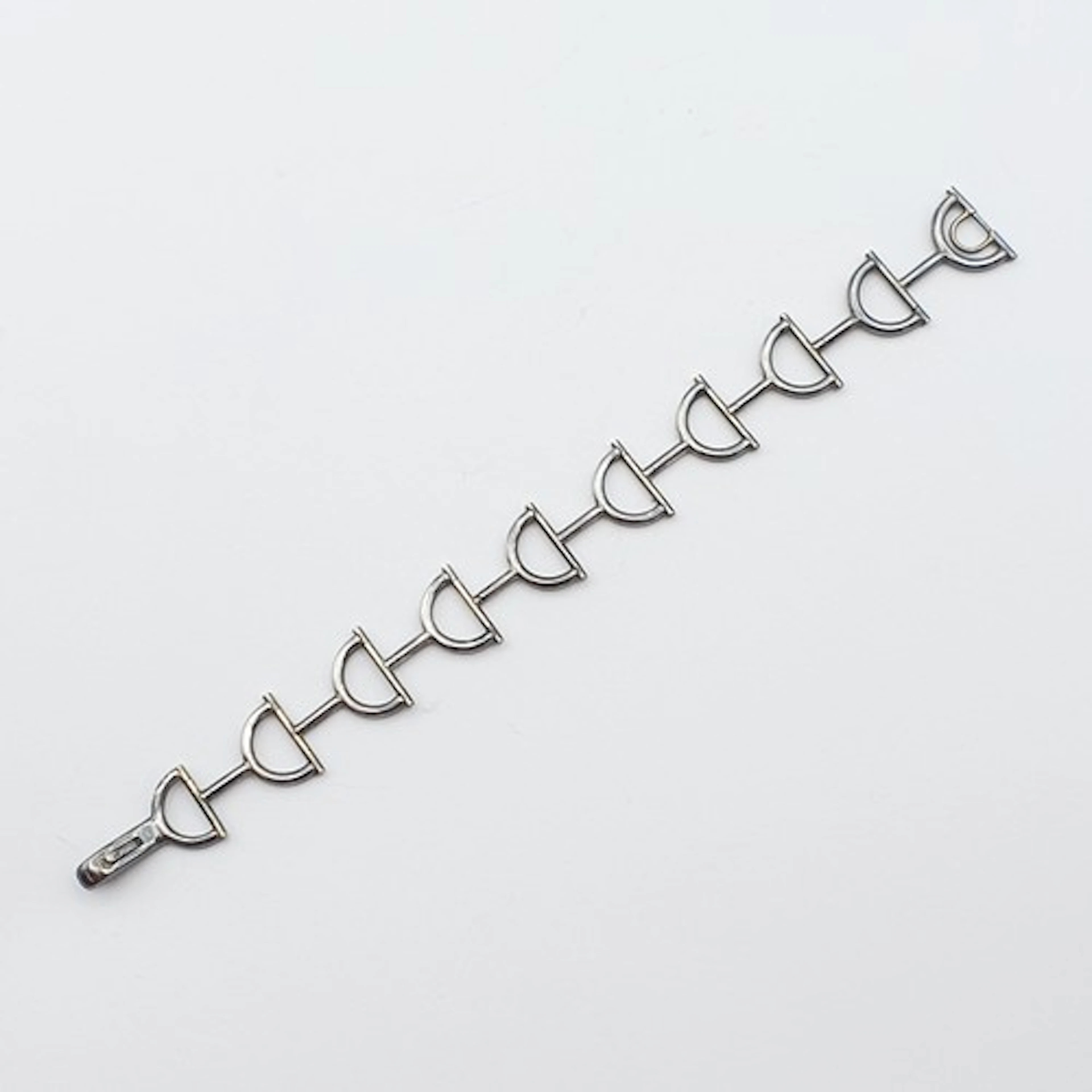 A silver folding Bracelet with horse bit design links, Sheff...