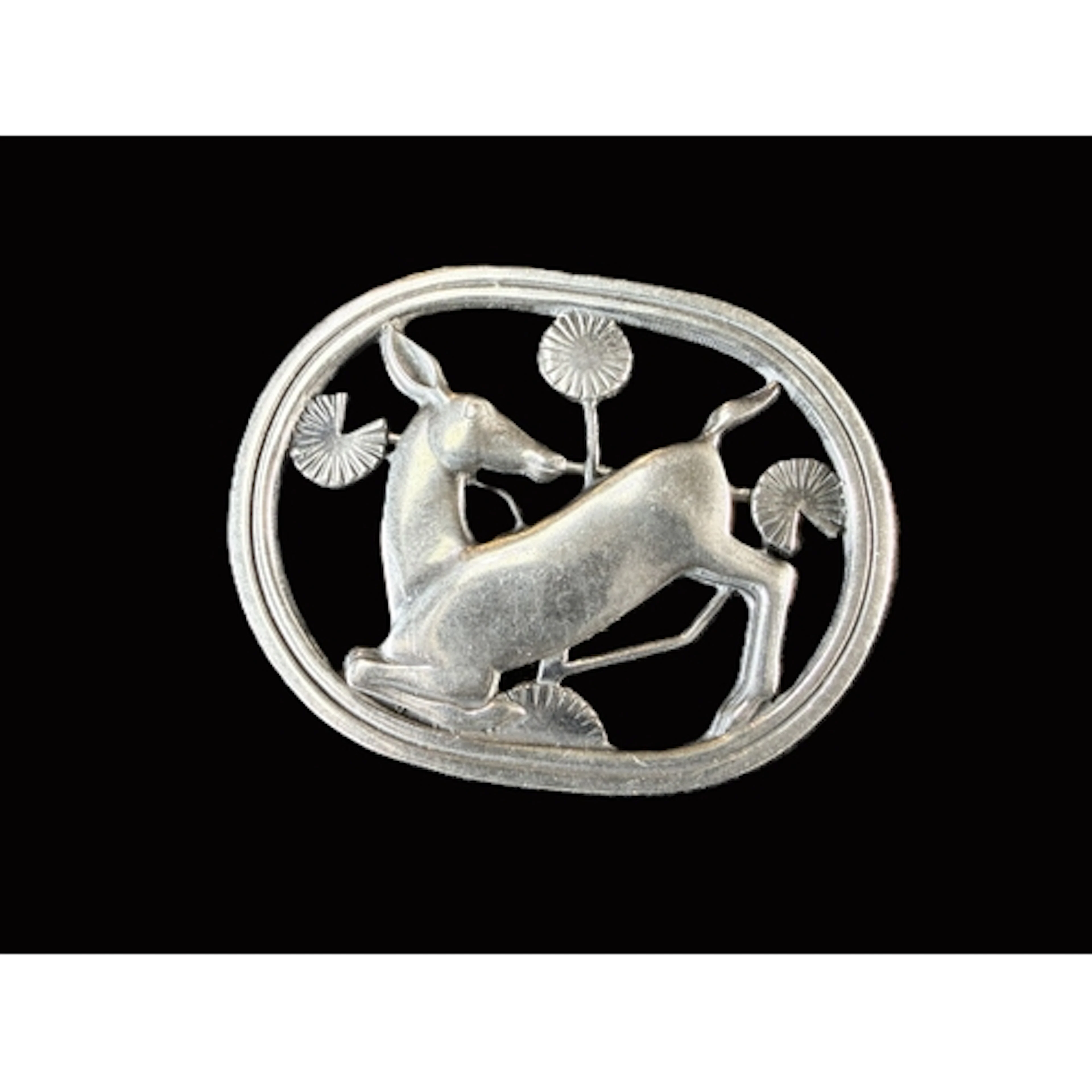 Georg Jensen: an openwork oval silver brooch 'Kneeling Deer'...