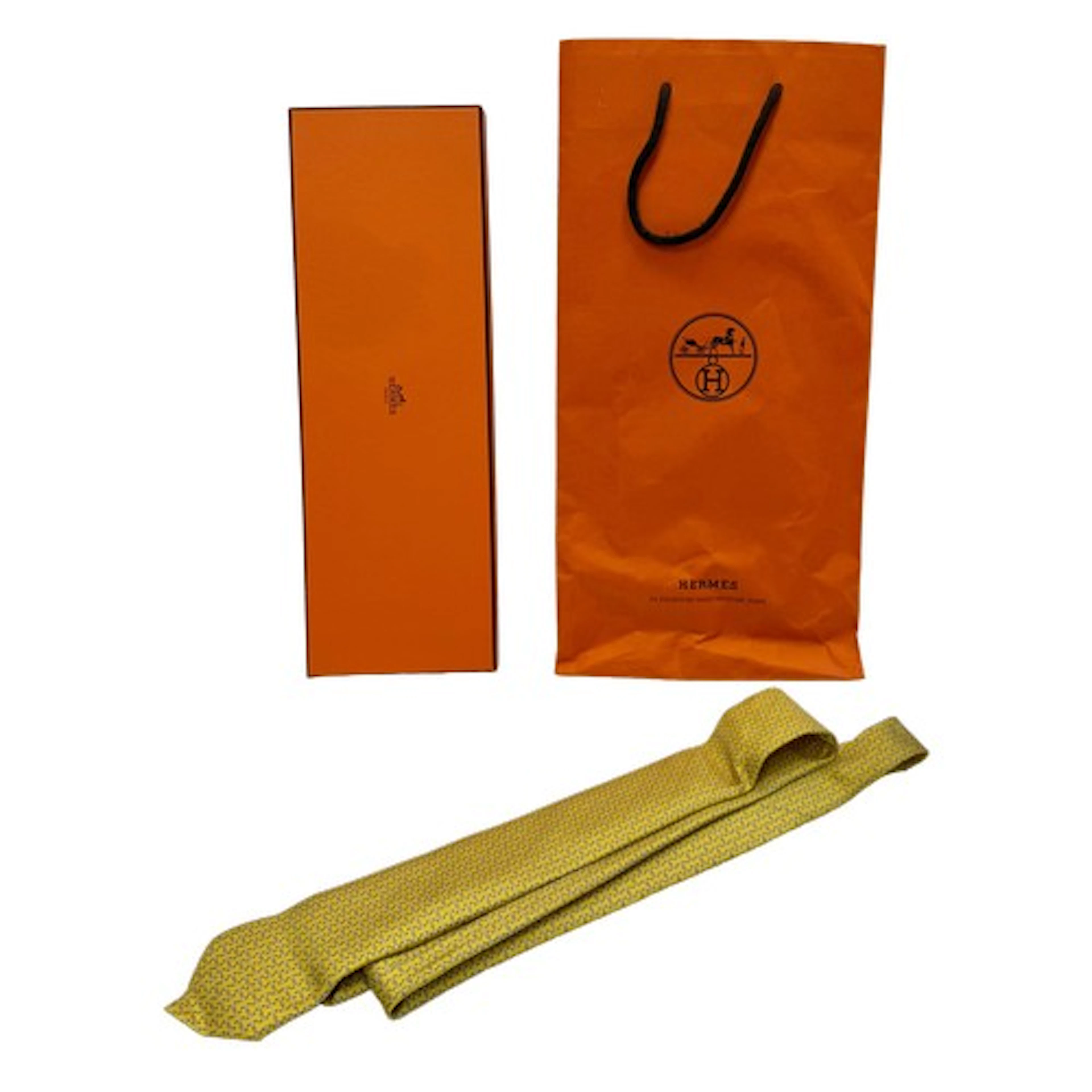 A Hermes yellow 100% silk tie, 6331 PA, boxed, 2023 ribbon a...